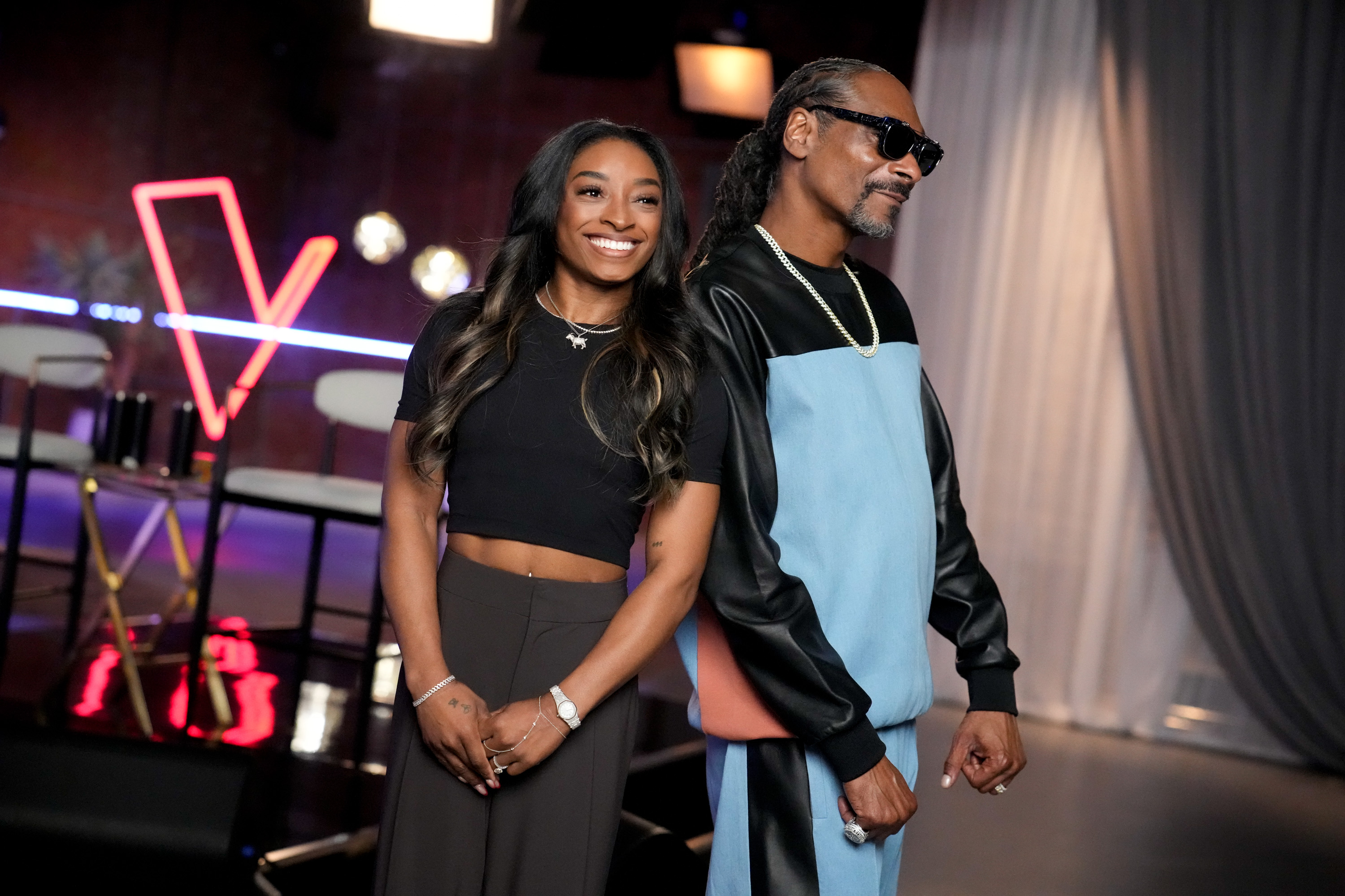 Simone Biles and Snoop Dogg. | Source: Getty Images