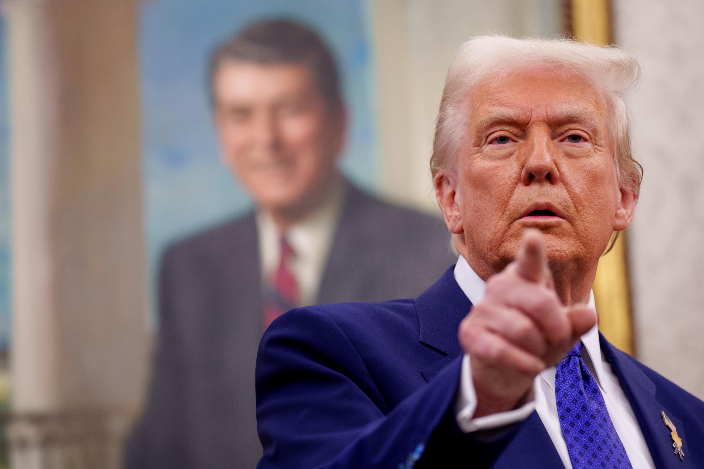 Donald Trump addressing a question from a reporter after Tulsi Gabbard was sworn in as Director of National Intelligence in Washington, D.C. on February 12, 2025. | Source: Getty Images