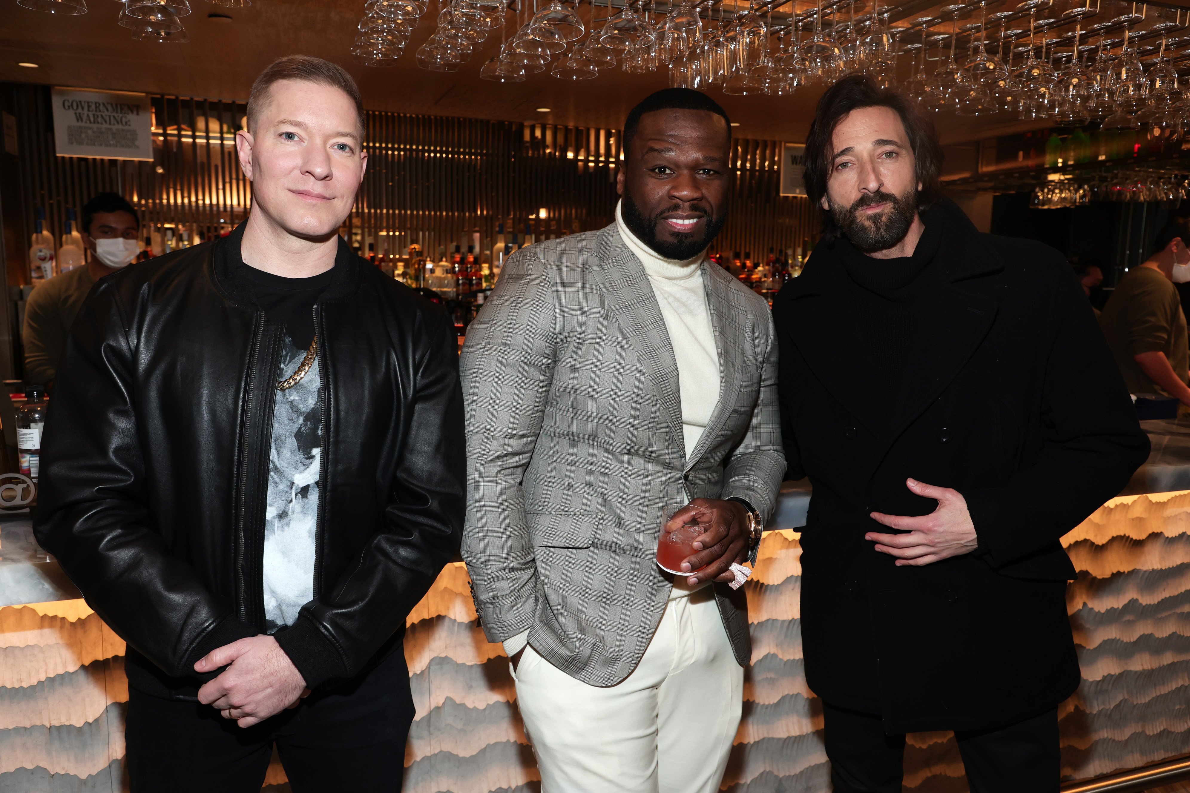 Joseph Sikora, Curtis “50 Cent” Jackson, and Adrien Brody pose for a photo at the "Power Book IV: Force" Premiere at Pier 17 Rooftop on January 28, 2022, in New York City | Source: Getty Images