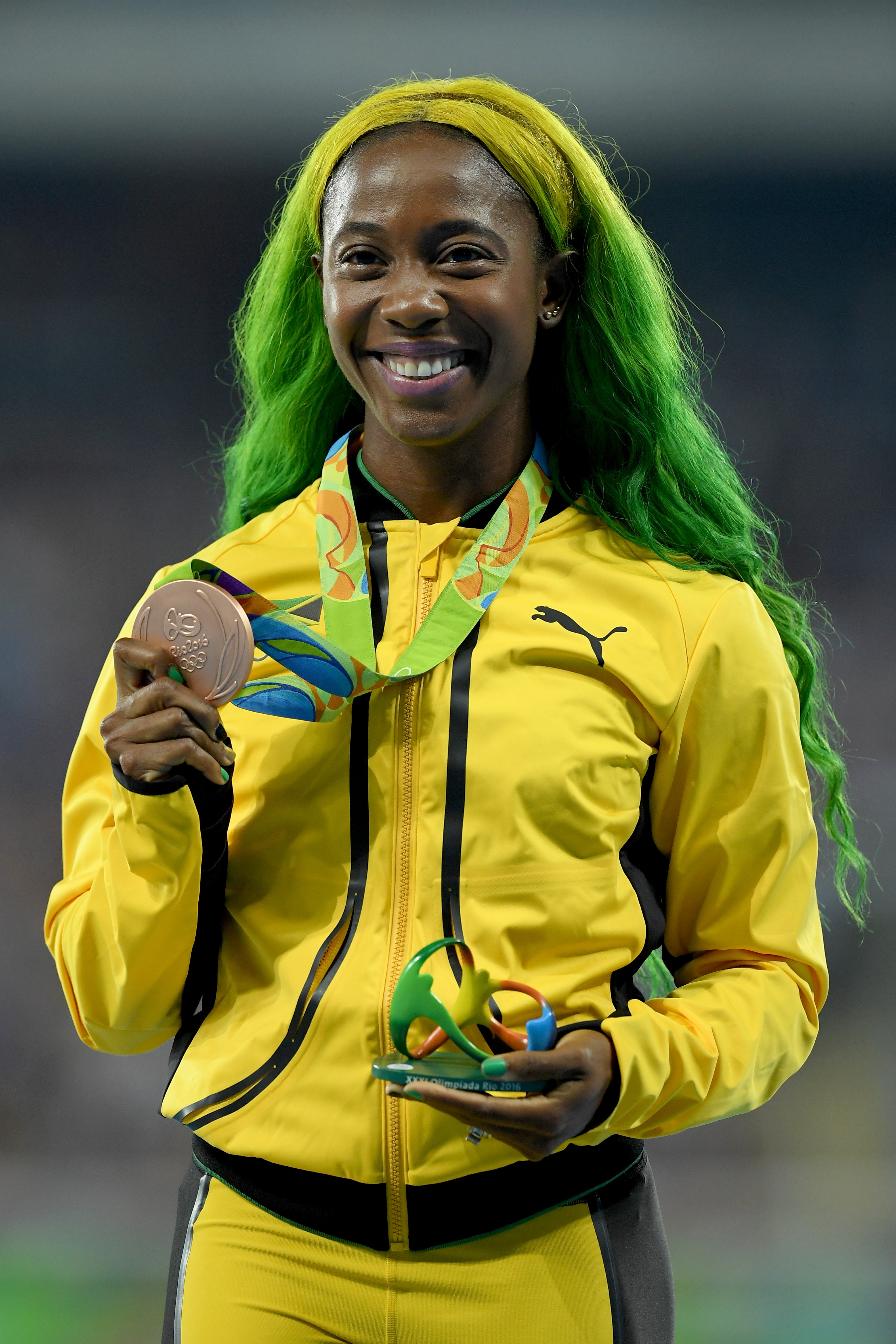 Shelly-Ann Fraser-Pryce poses with the bronze medal for the Women's 100m at the Rio 2016 Olympic Games on August 14, 2016, in Rio de Janeiro, Brazil. | Source: Getty Images