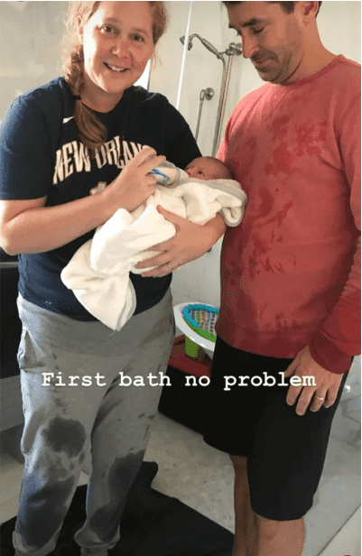 Baby Gene with his parents after they gave him his first bath. I Image: Instagram/ amyschumer.