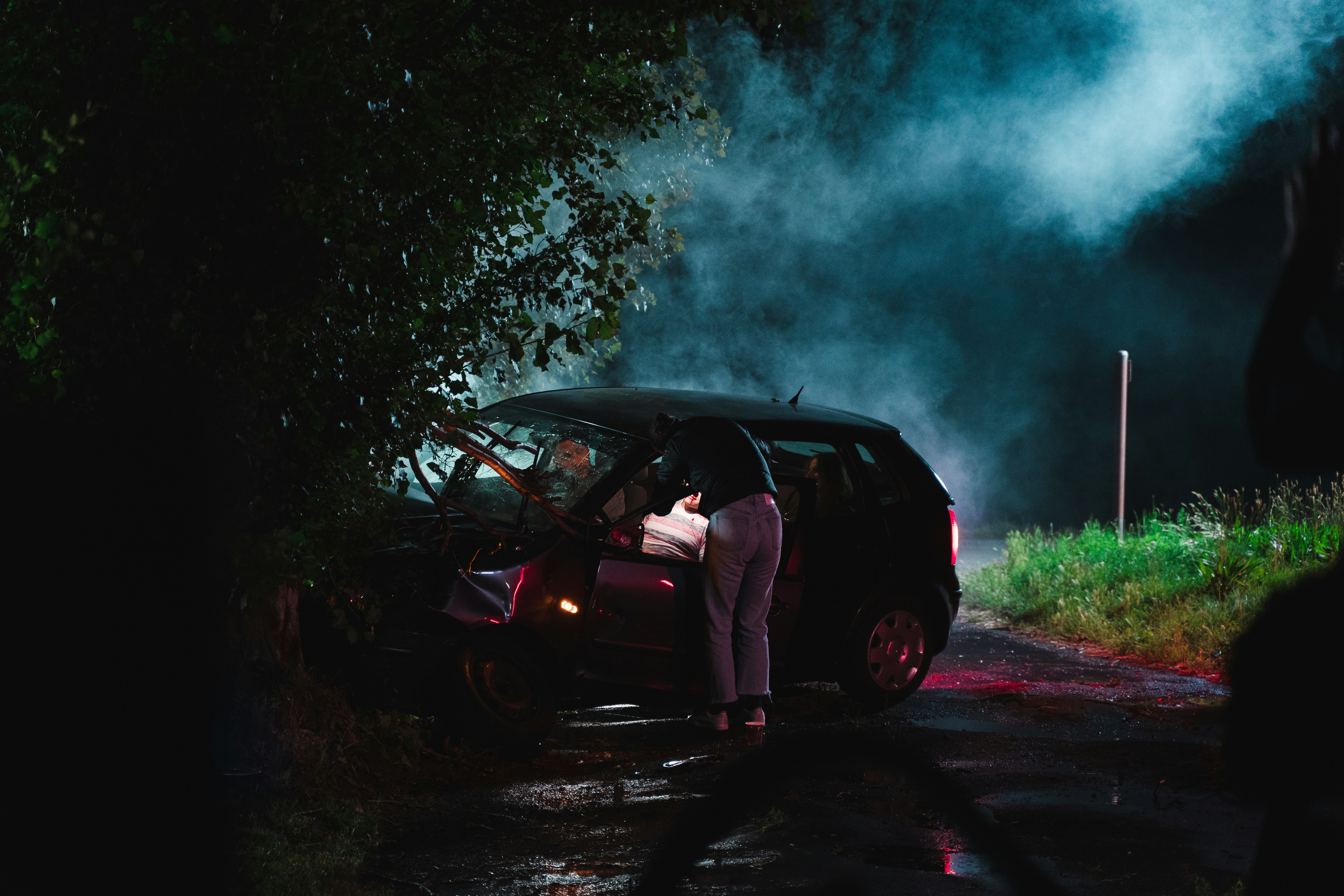 A person standing at a car crash scene | Source: Unsplash