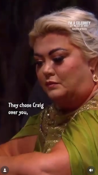 Arms folded and gaze cast downward, Gemma Collins absorbs the caption 