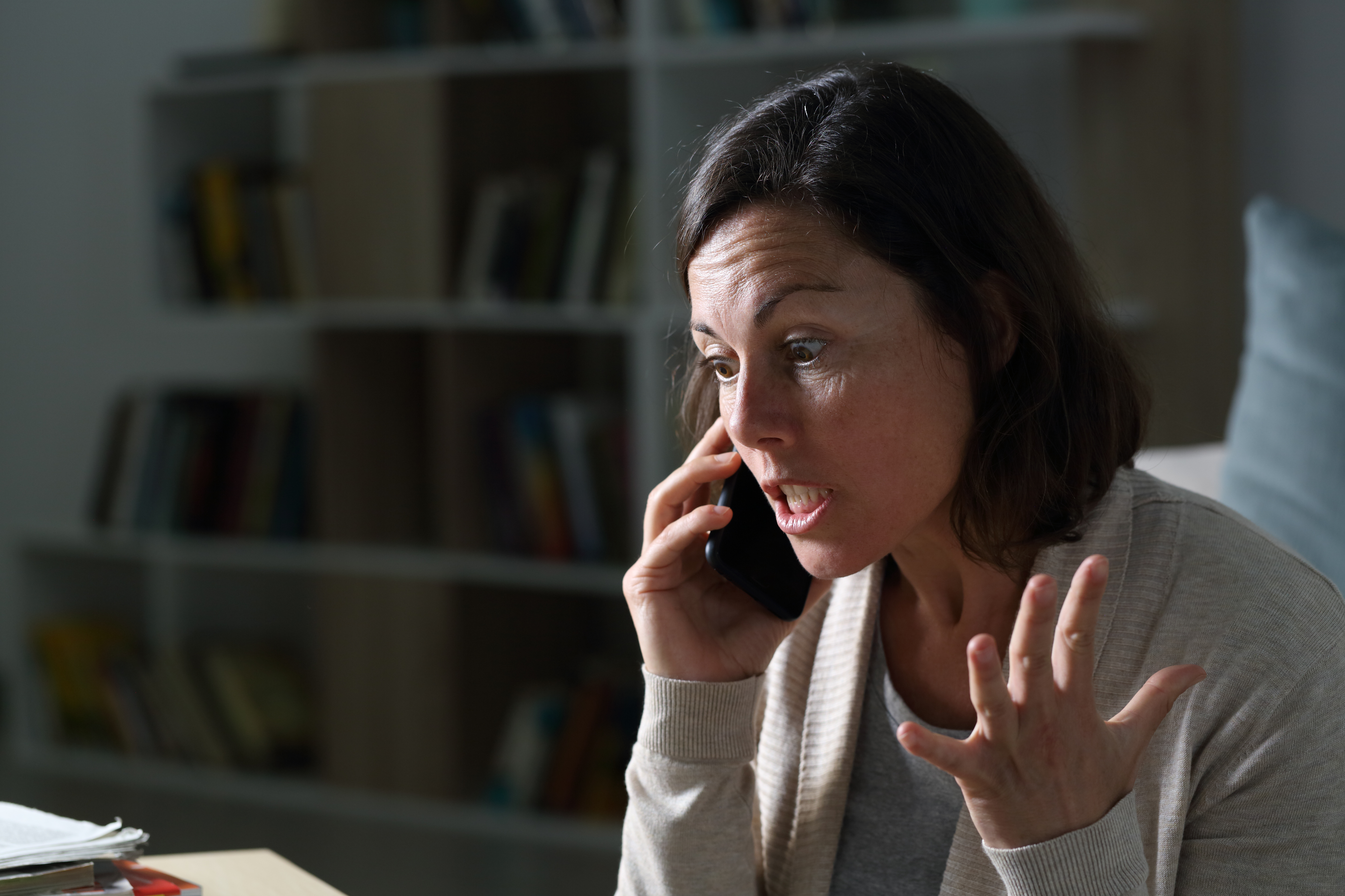 A woman looking angry while on the phone | Source: Shutterstock