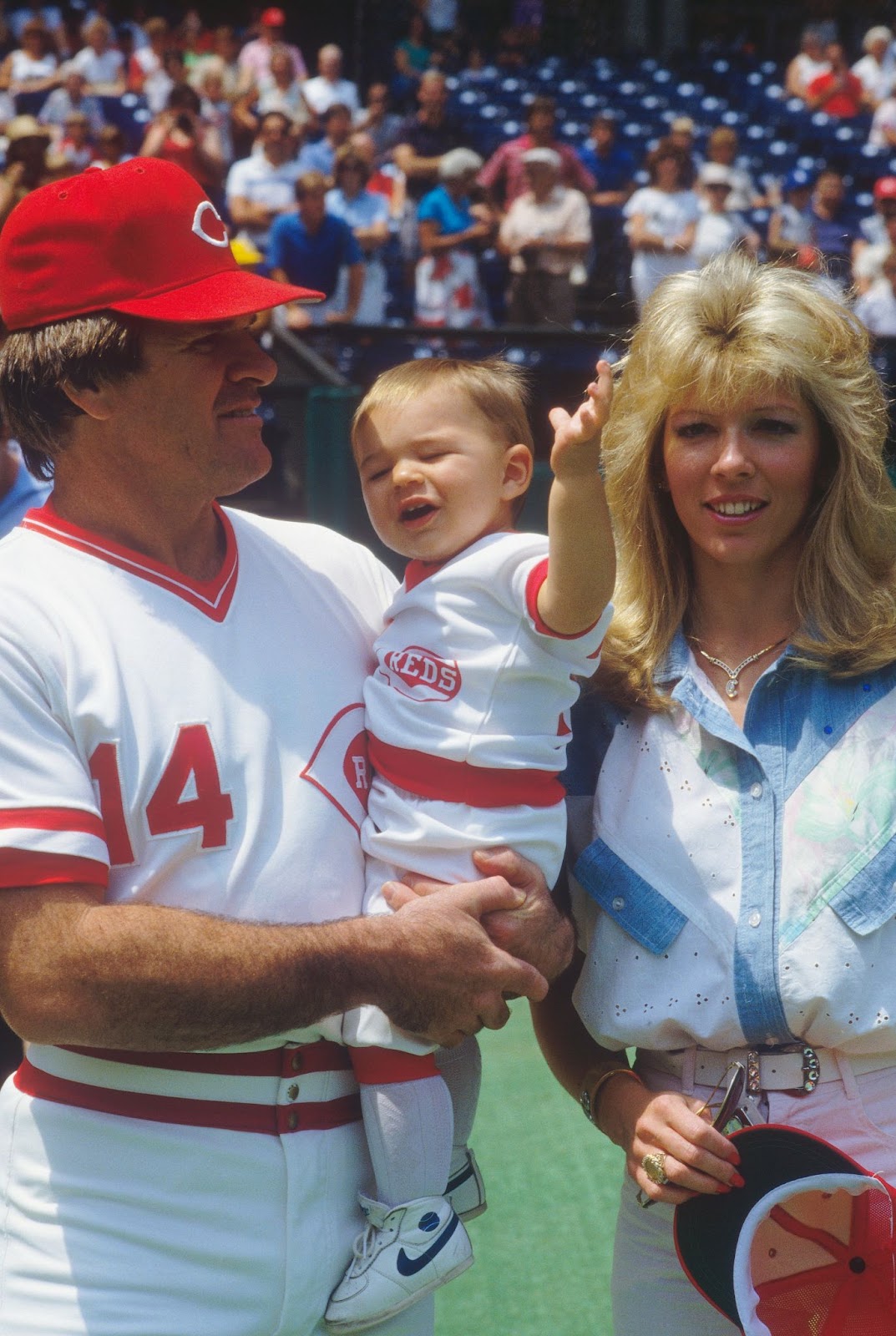 Pete Rose, Tyler Rose, and Carol J. Woliung photographed at Riverfront Stadium in Cincinnati, Ohio, circa 1980s. | Source: Getty Images