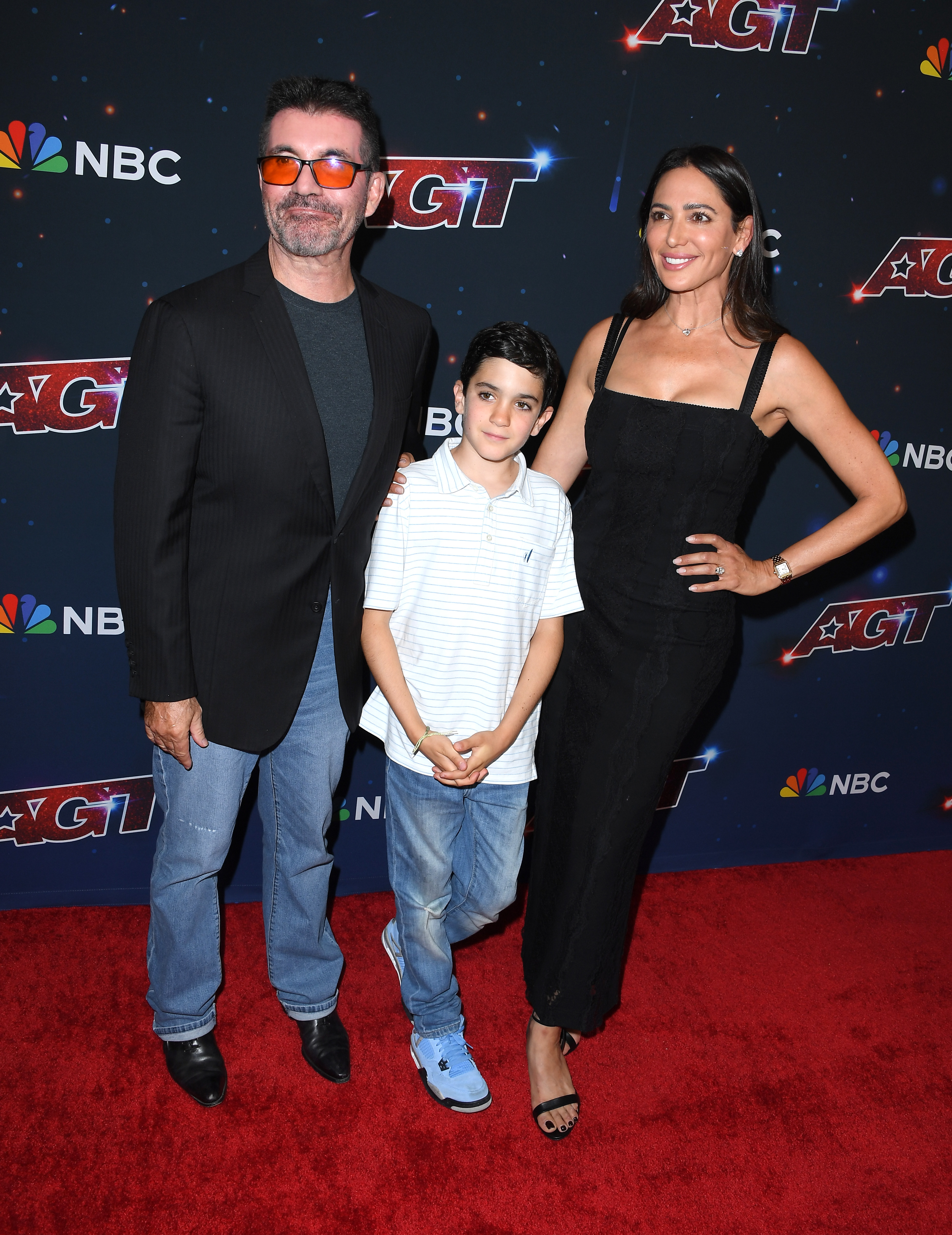 Simon and Eric Cowell with Lauren Silverman at the season 18 season finale red carpet event for "America's Got Talent" | Source: Getty Images
