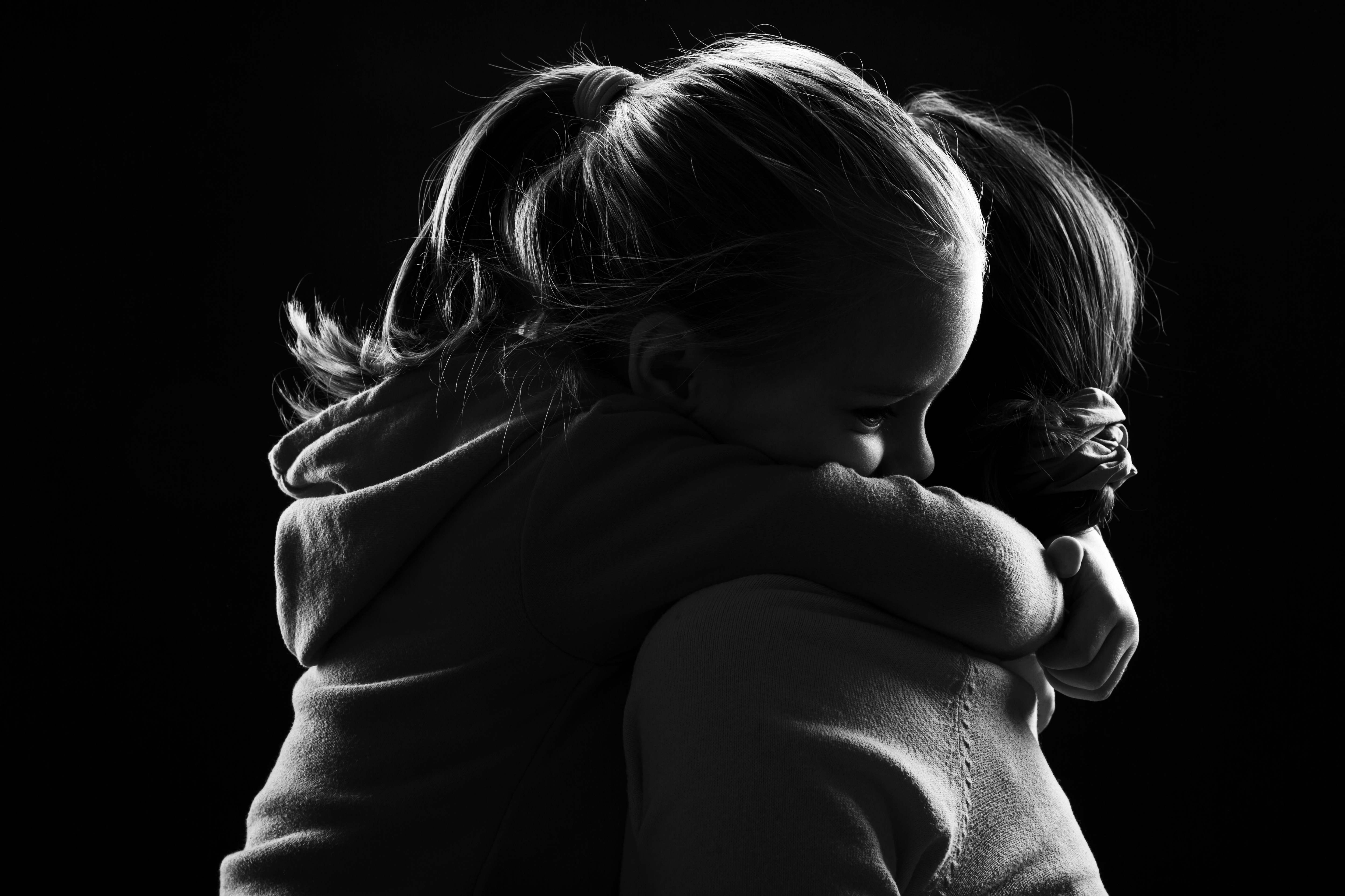 Little girl hugs her mother | Source: Shutterstock