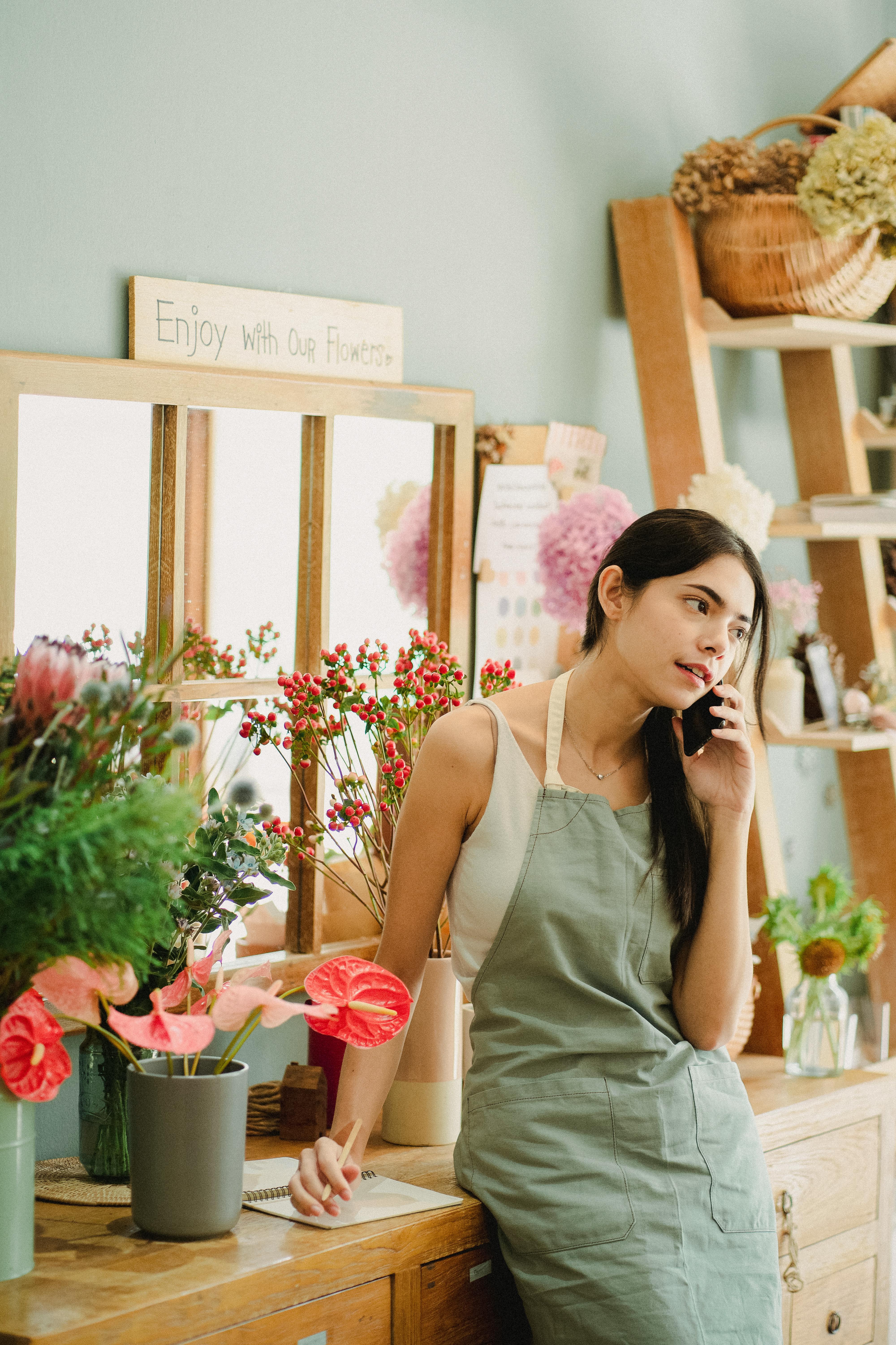 A young woman talking on her phone | Source: Midjourney