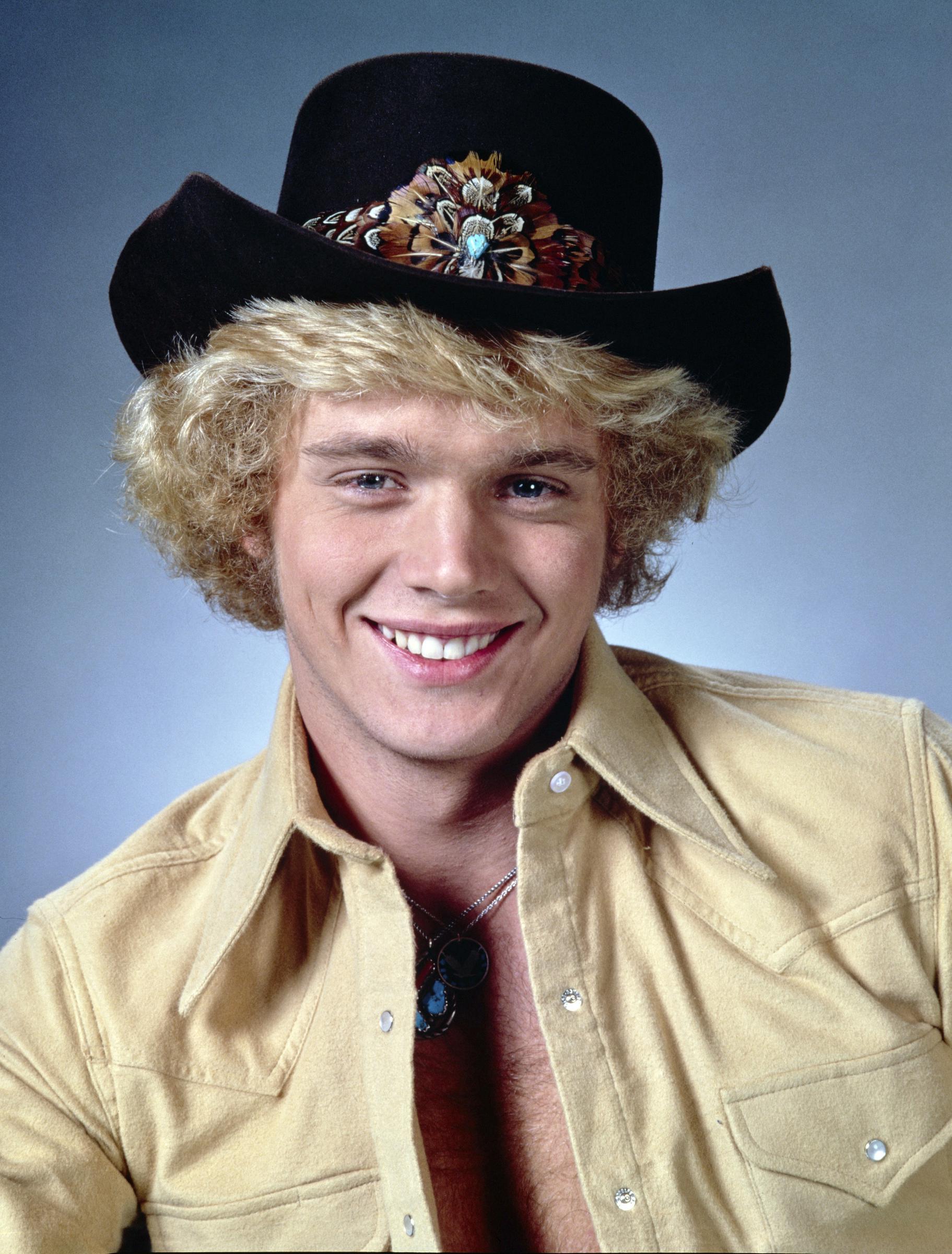 This 1982 studio portrait shows Schneider in the Western styling that helped define Bo Duke's clean-cut image during the show's peak years. The cowboy hat and open-collar shirt reflect the rural persona that remained closely tied to his public image for decades. | Source: Getty Images