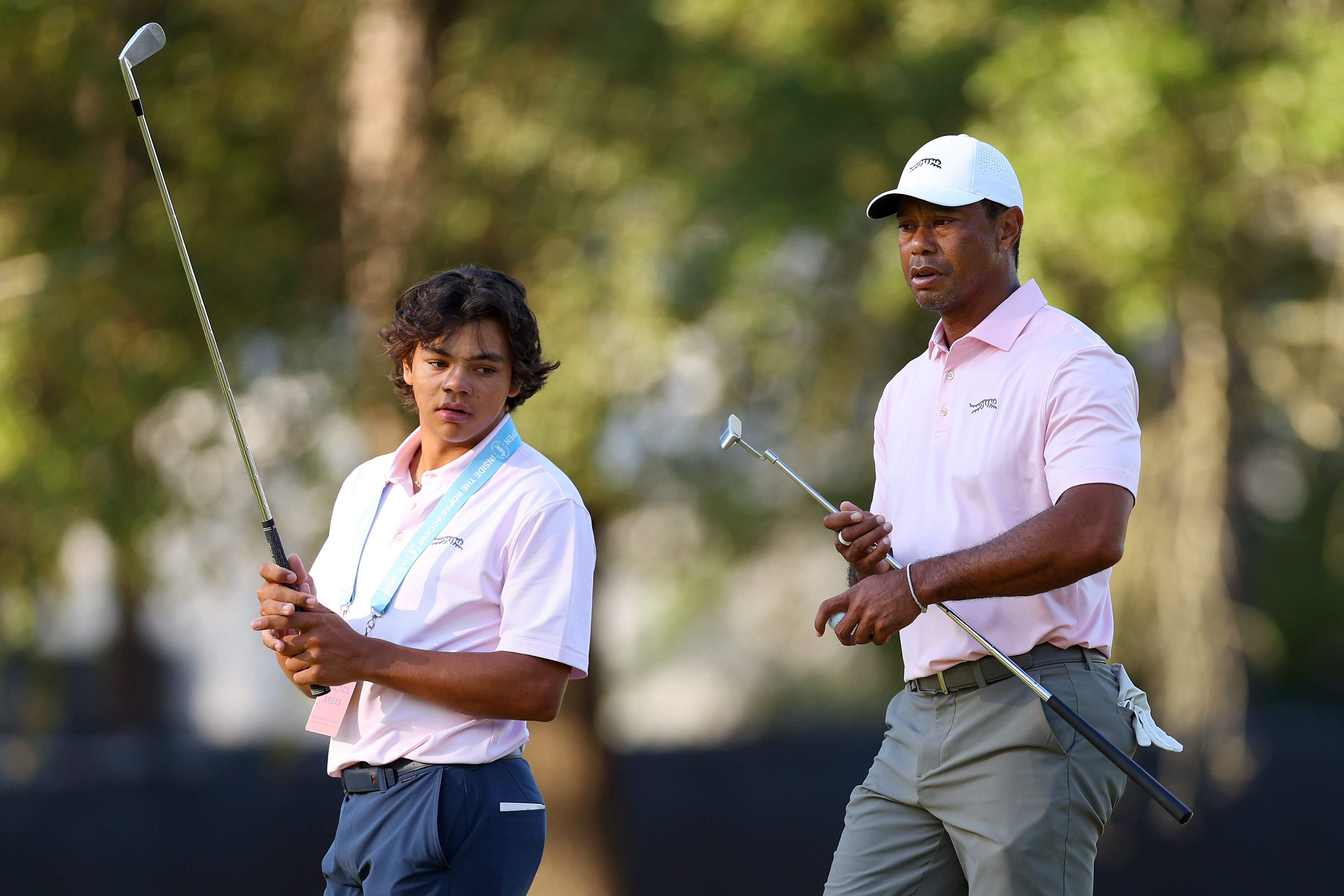 Tiger Woods and Charlie Woods, look on from the second hole during a practice round prior to the U.S. Open at Pinehurst Resort in North Carolina on June 11, 2024. | Source: Getty Images