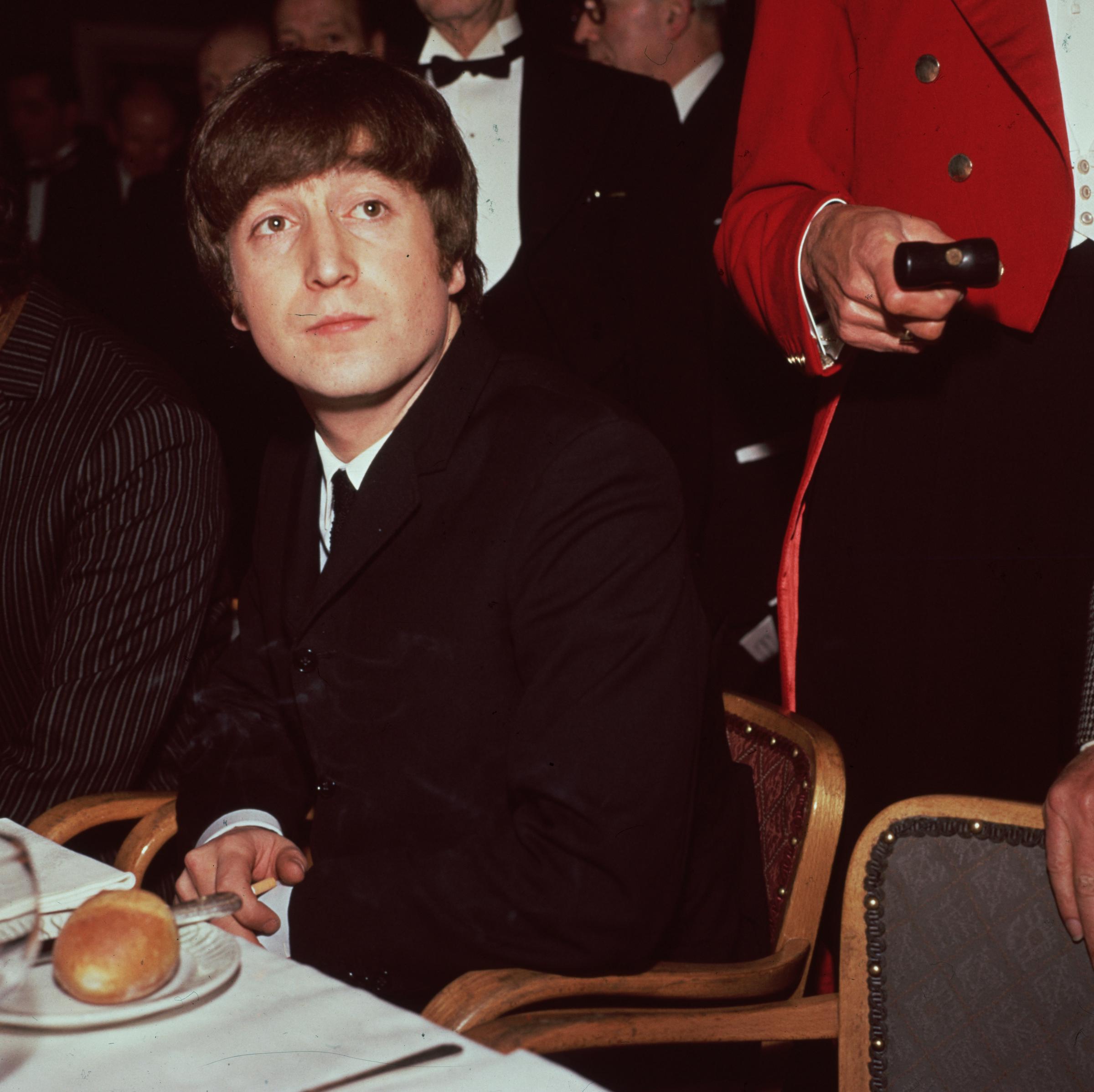 John Lennon photographed in London, England, in 1964. | Source: Getty Images