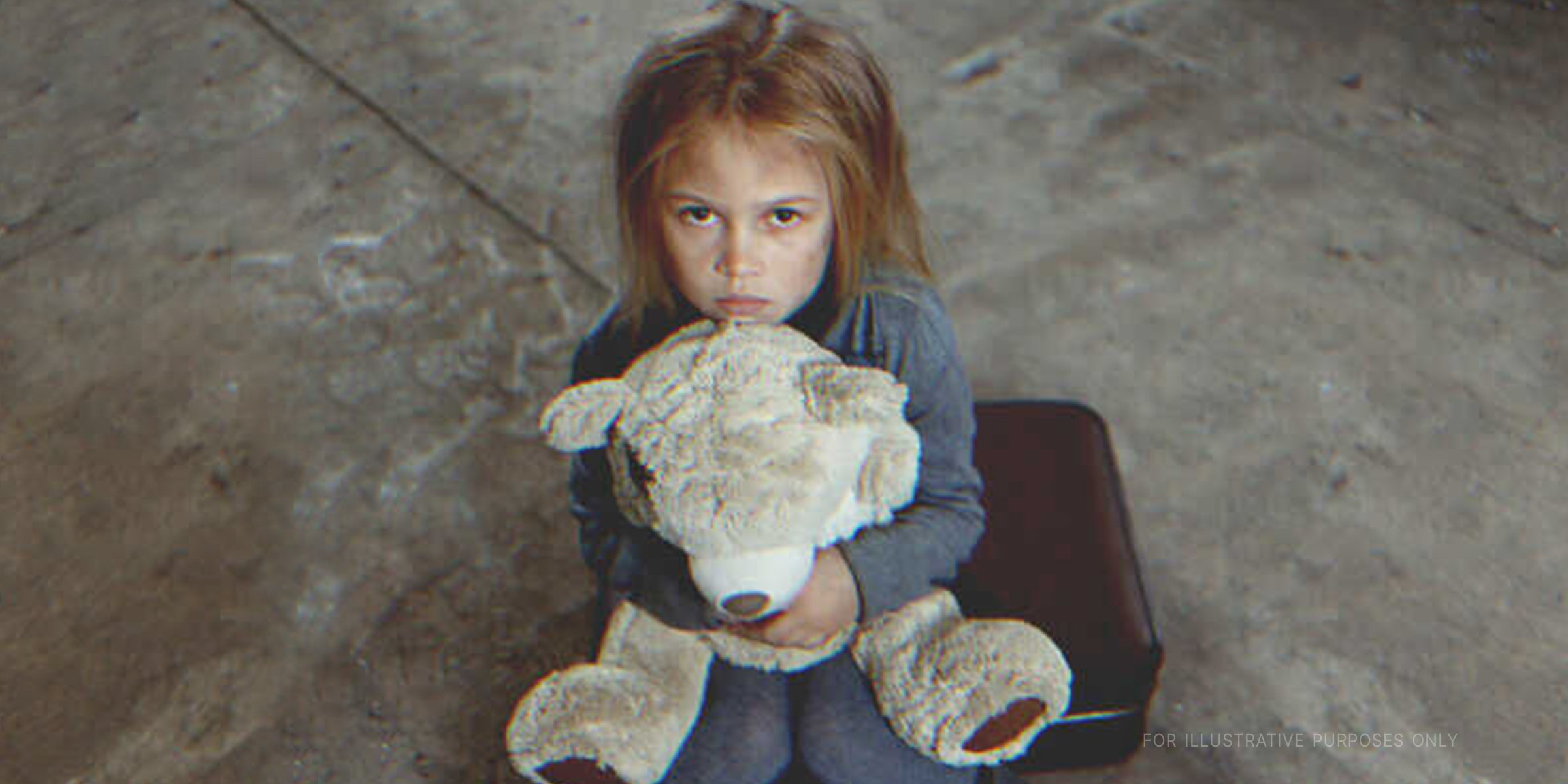 Girl hugs a teddy bear | Source: Shutterstock