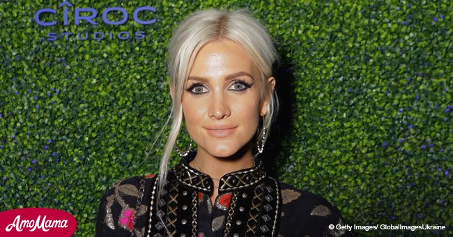 Ashlee Simpson and her hubby look so in love as they cuddle up to one another during recent event