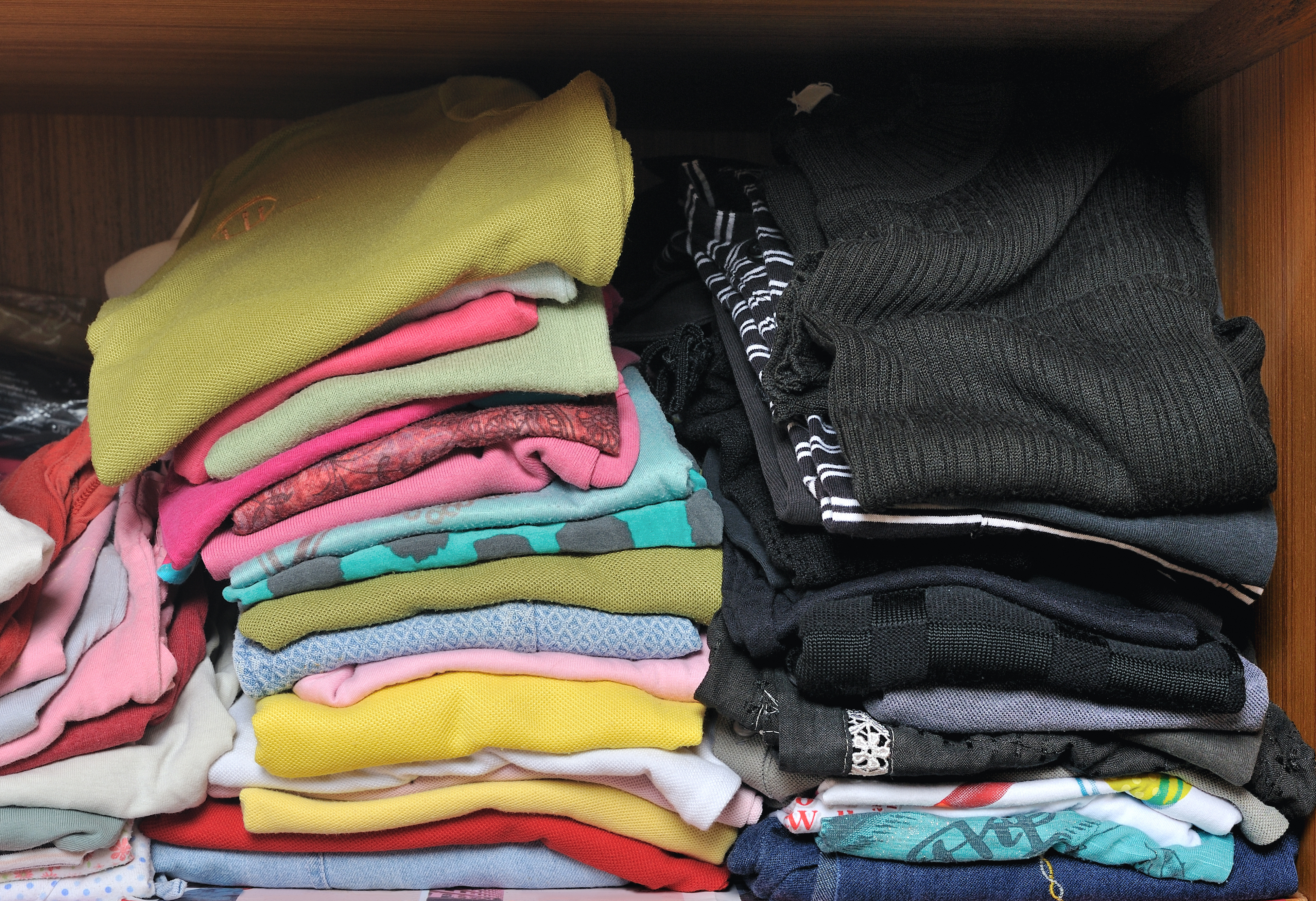 A pile of clothes in a closet | Source: Shutterstock