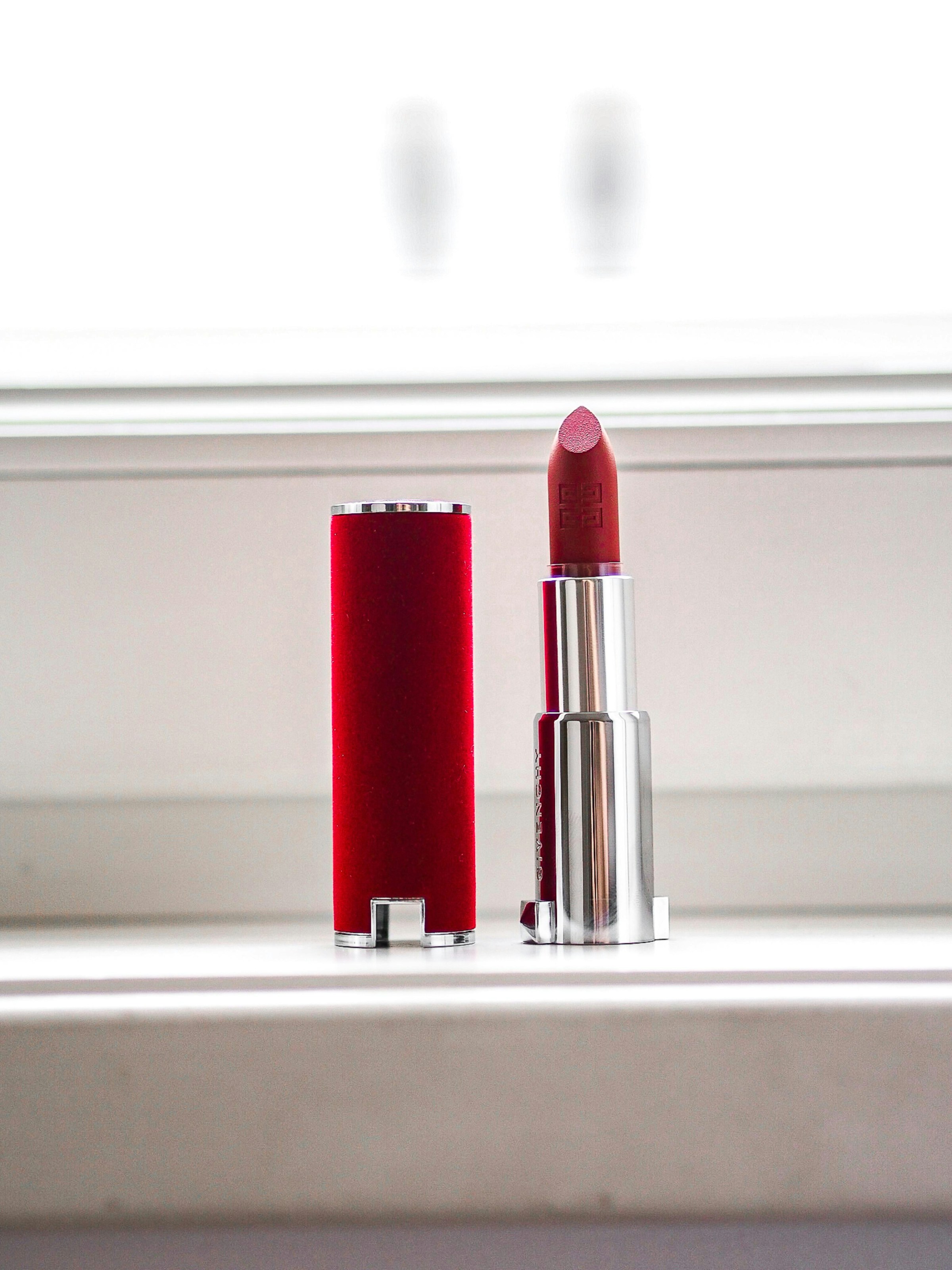 Red lipstick on a white table | Source: Unsplash