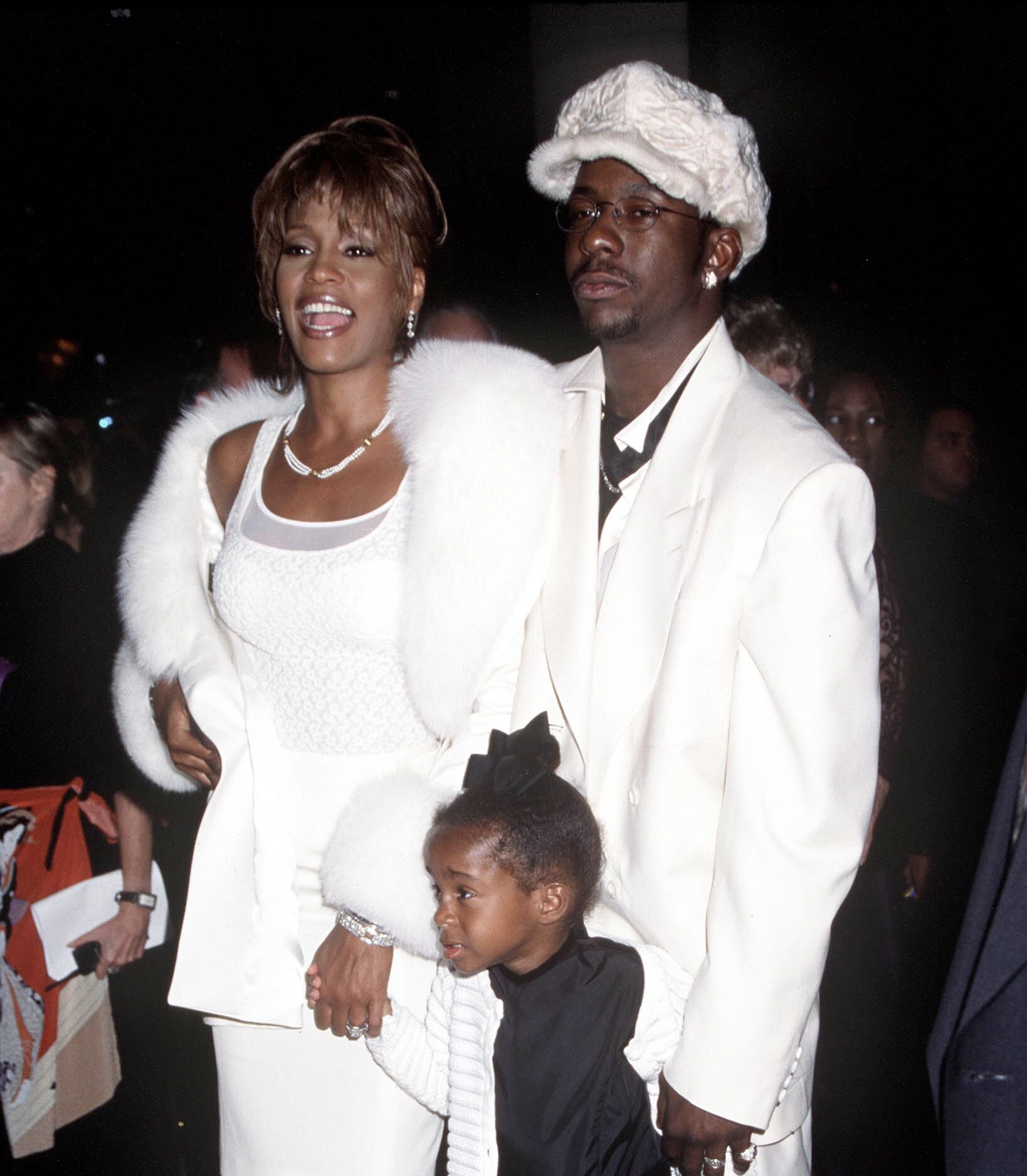 Iconic singer Whitney Houston with husband Bobby Brown and daughter Bobby Kristina in Los Angeles in 1989/ Getty Images