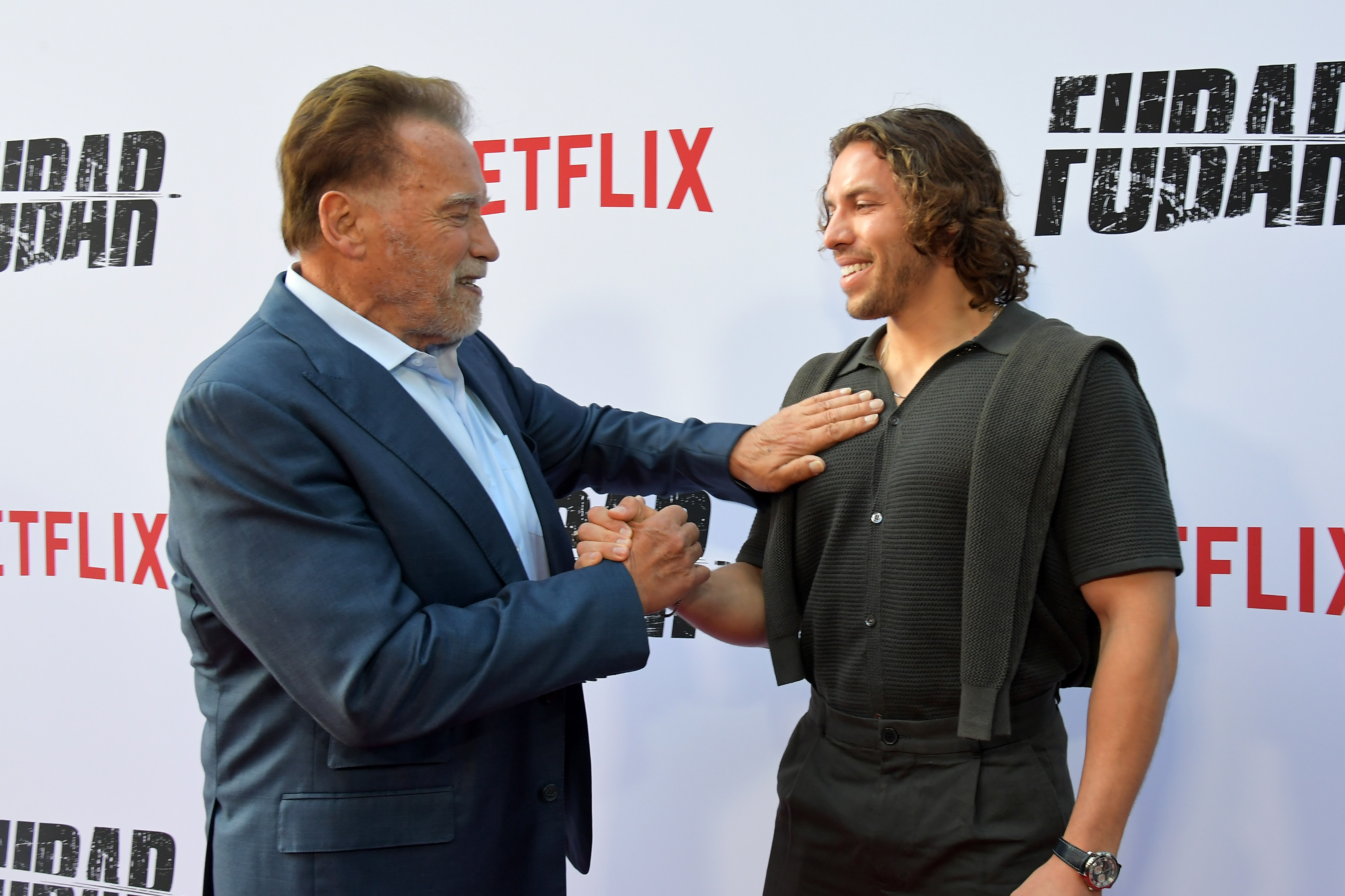 Arnold Schwarzenegger and Joseph Baena attend the premiere of "Fubar" Season 2 at Netflix Tudum Theater on June 11, 2025, in Los Angeles, California | Source: Getty Images