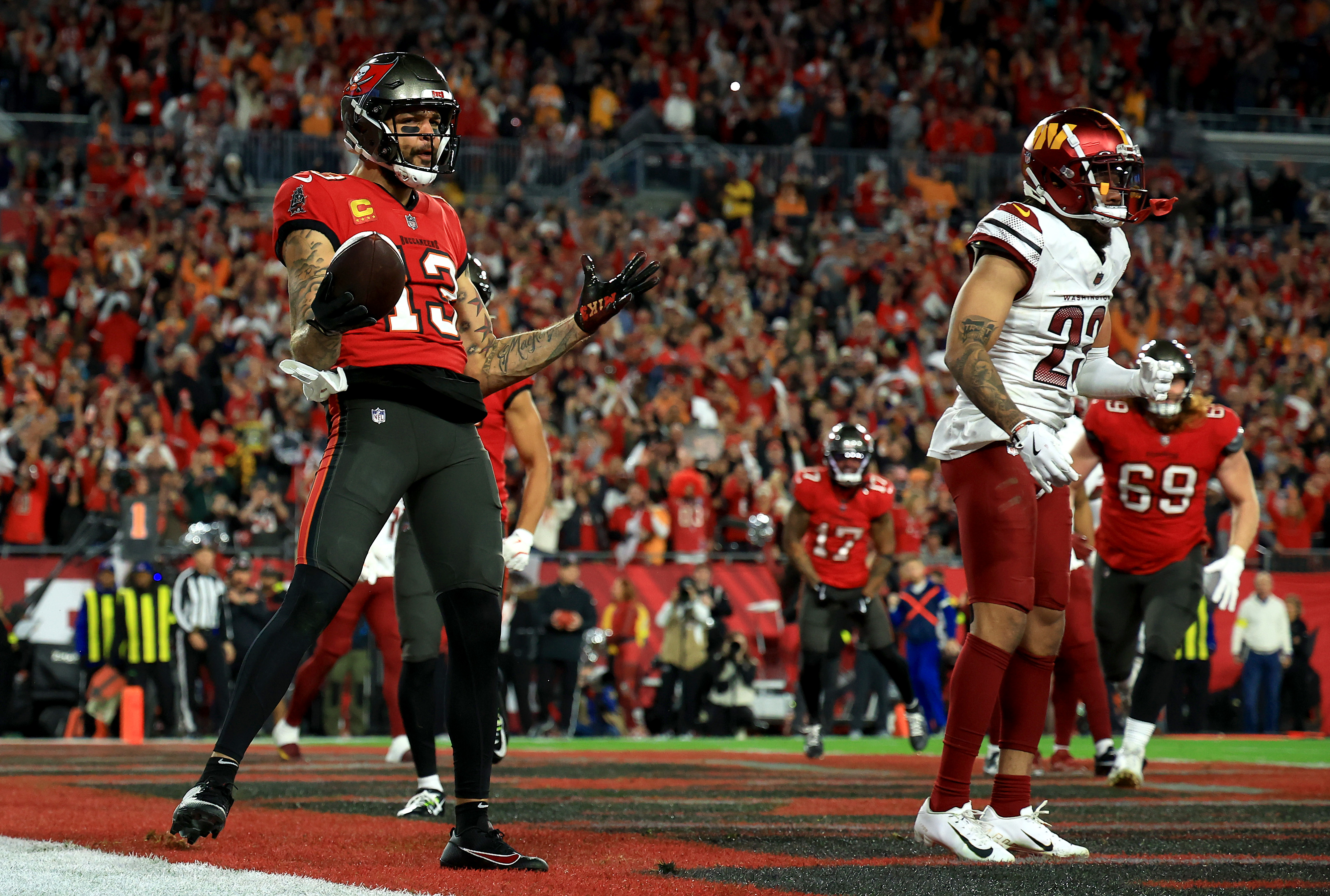 Mike Evans #13 of the Tampa Bay Buccaneers celebrates after scoring a touchdown against the Washington Commanders on January 12, 2025, in Tampa, Florida | Source: Getty Images