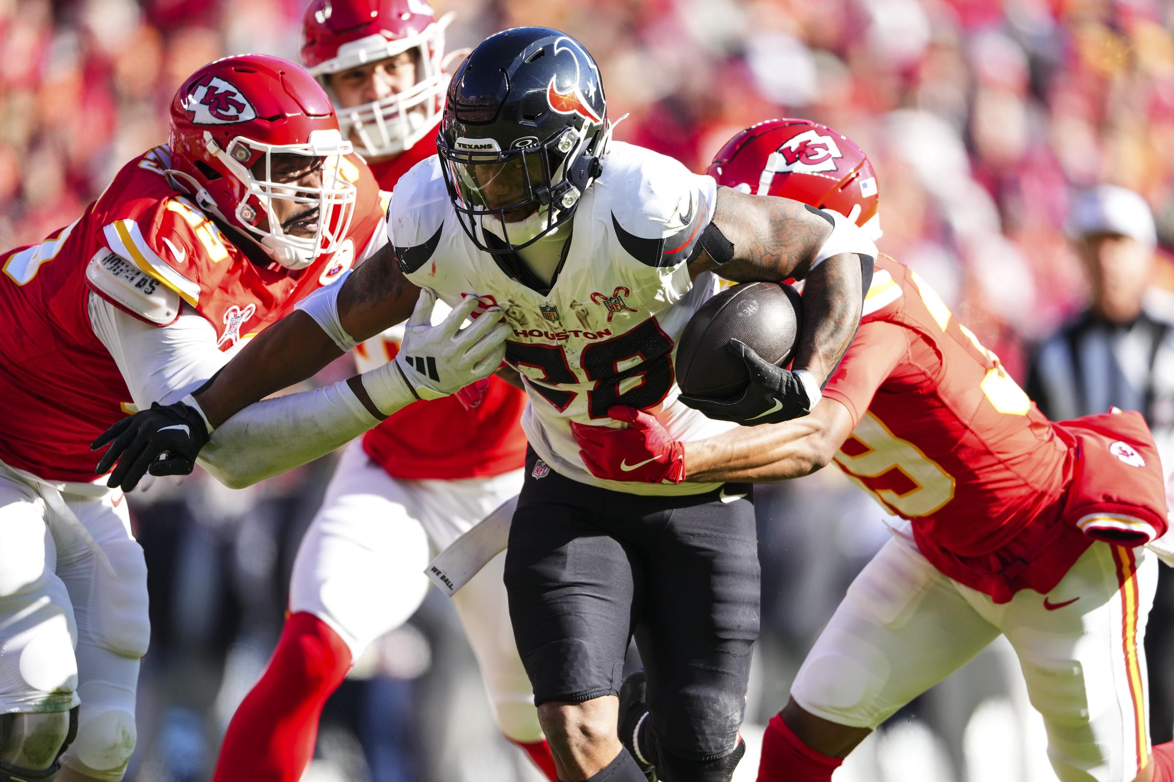 Houston Texans run the ball against the Kansas City Chiefs at Arrowhead Stadium on December 21, 2024 | Source: Getty Images