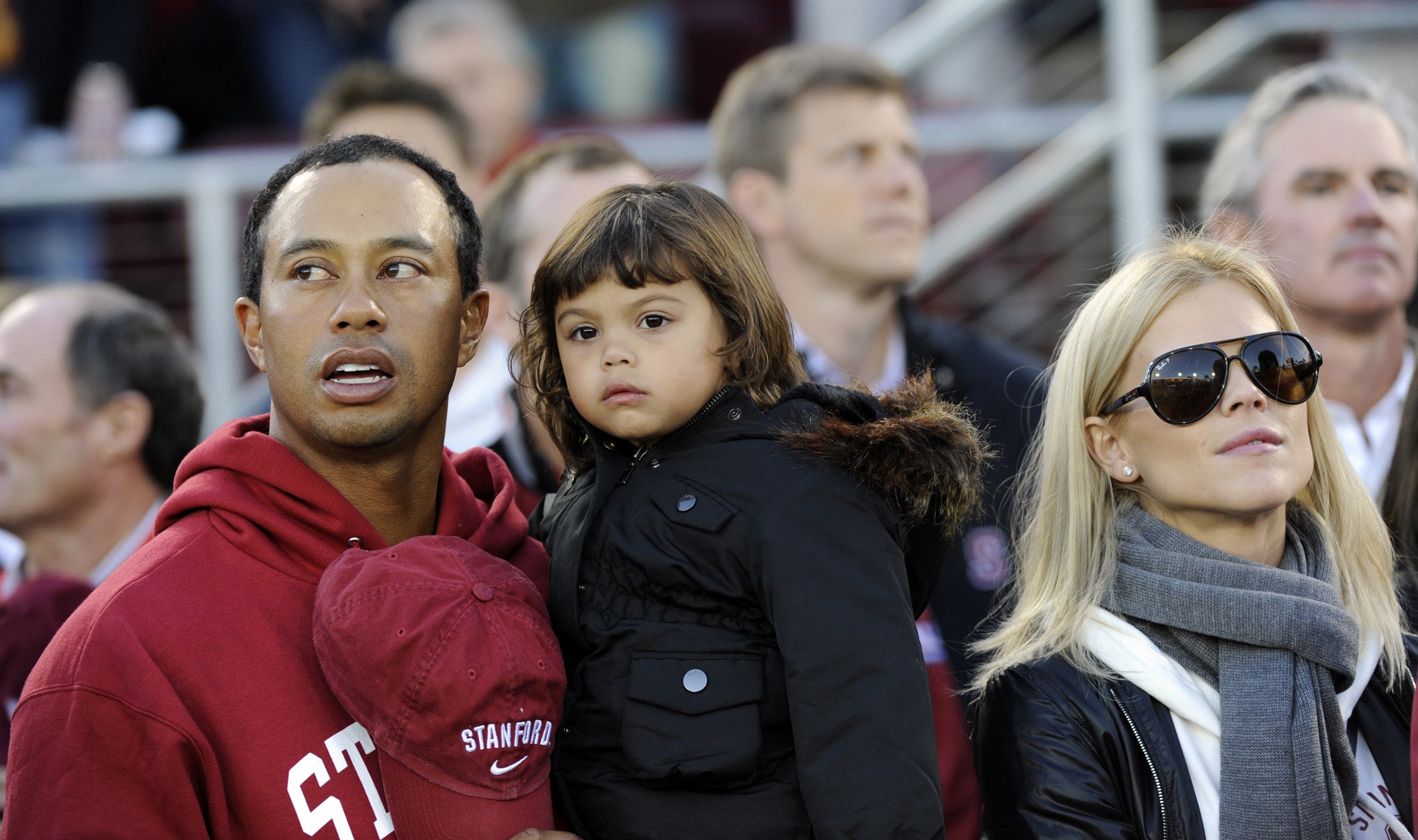 Tiger Woods pictured with daughter Sam Alexis Woods, and wife Elin Woods on sidelines during an NCAA football game at Stanford Stadium, Stanford, California. | Source: Getty Images