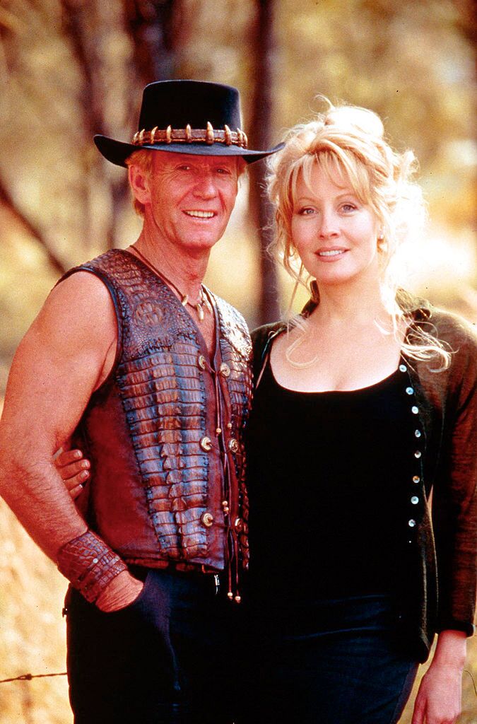 Paul Hogan and Linda Koslowski pose for a photo on the set of "Crocodile Dundee in Los Angeles." | Source: Getty Images