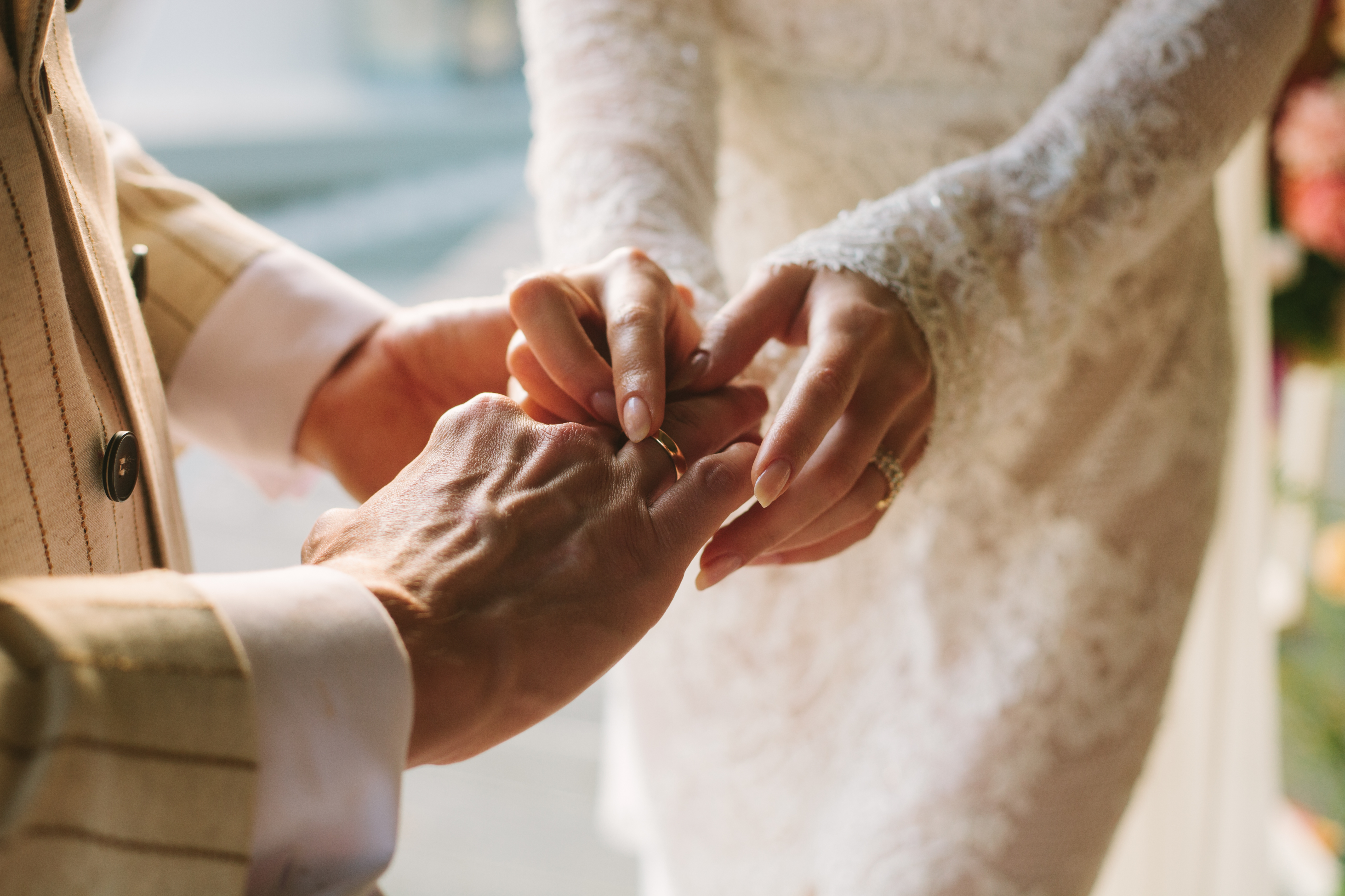 A man holding his bride's hand | Source: Getty Images