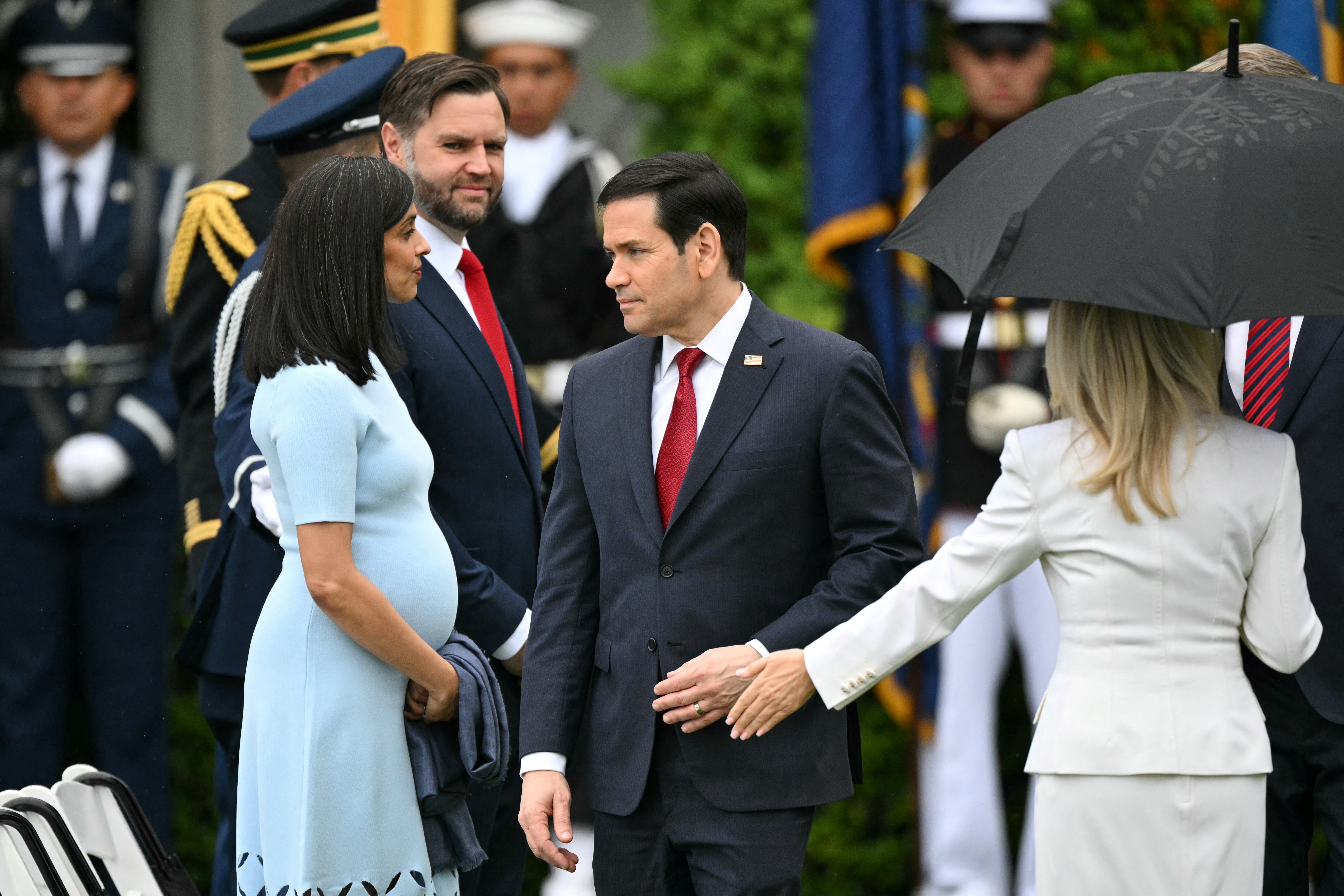 Marco Rubio speaks with Vice President JD Vance and Usha Vance at the White House South Lawn, April 28, 2026. | Source: Getty Images
