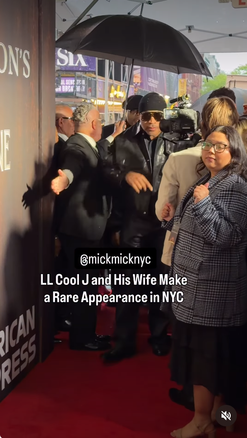 LL Cool J arrives under an umbrella on a rain-soaked red carpet at the opening night of "Joe Turner’s Come and Gone," wearing a black leather jacket, matching pants, and sunglasses, as staff guide him through the crowd. | Source: Instagram/mickmicknyc
