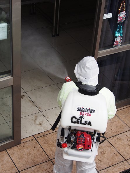 A man pictured fumigating a building | Photo: Getty Images