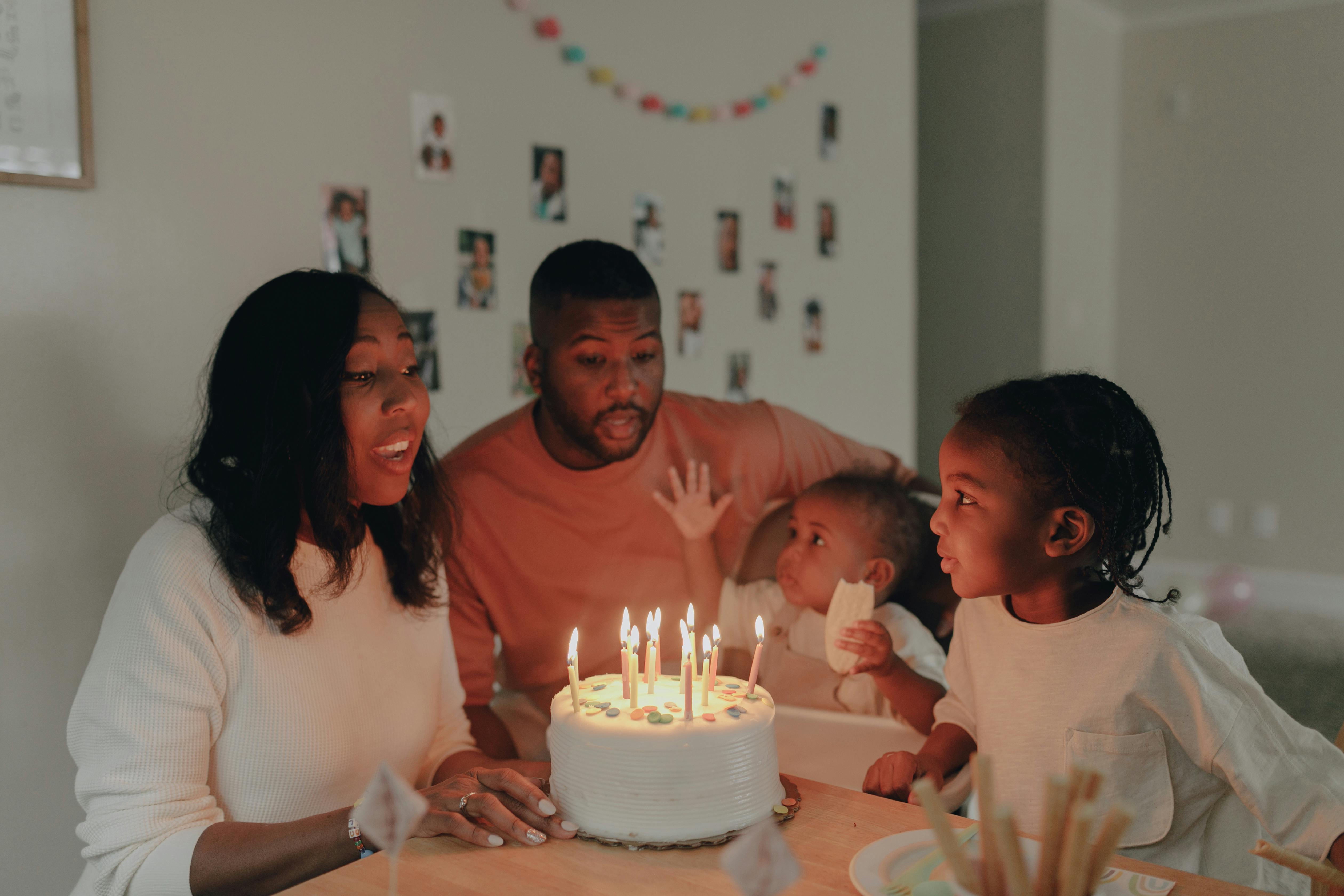 A young family celebrating a birthday | Source: Pexels