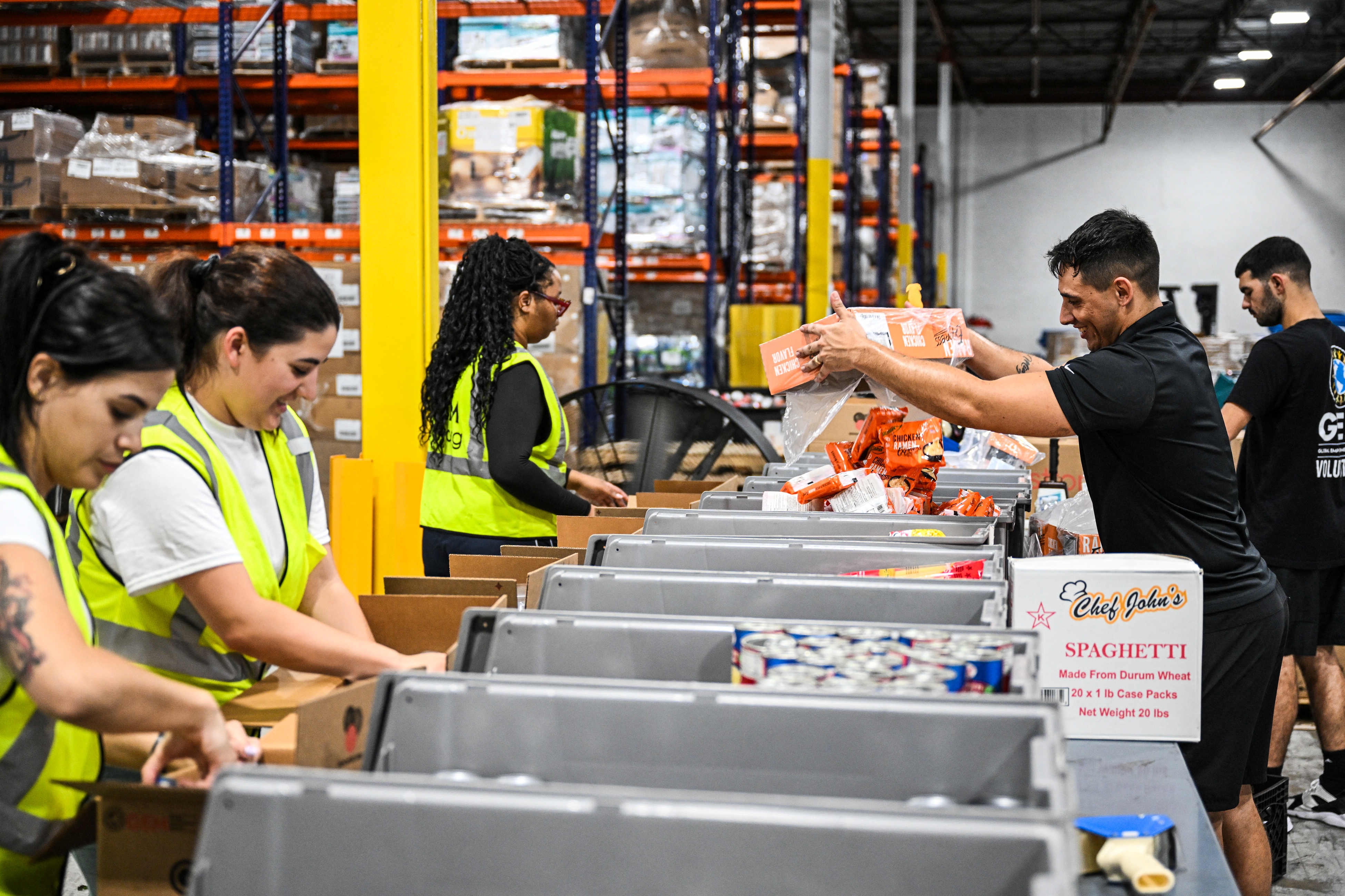 Volunteers assemble relief packages for Hurricane Melissa. | Source: Getty Images