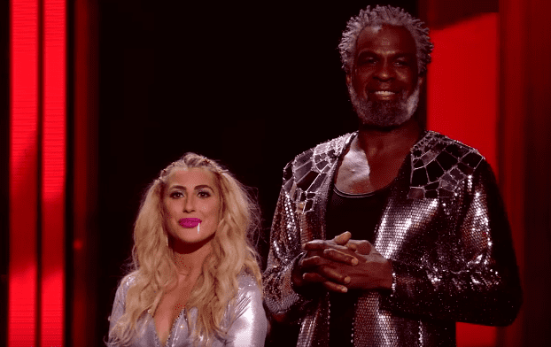 Former NBA player Charles Oakley and his dance partner, Emma Slater, during the eviction show on "Dancing With The Stars". | Photo: YouTube/Dancing With The Stars