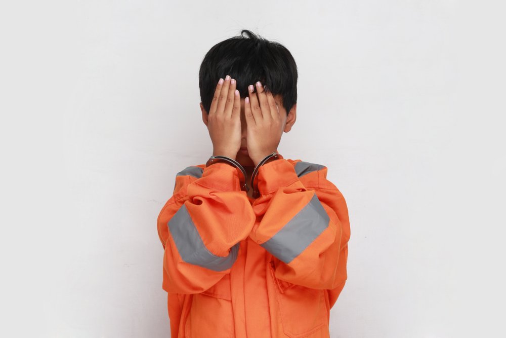 Young boy arrested | Shutterstock