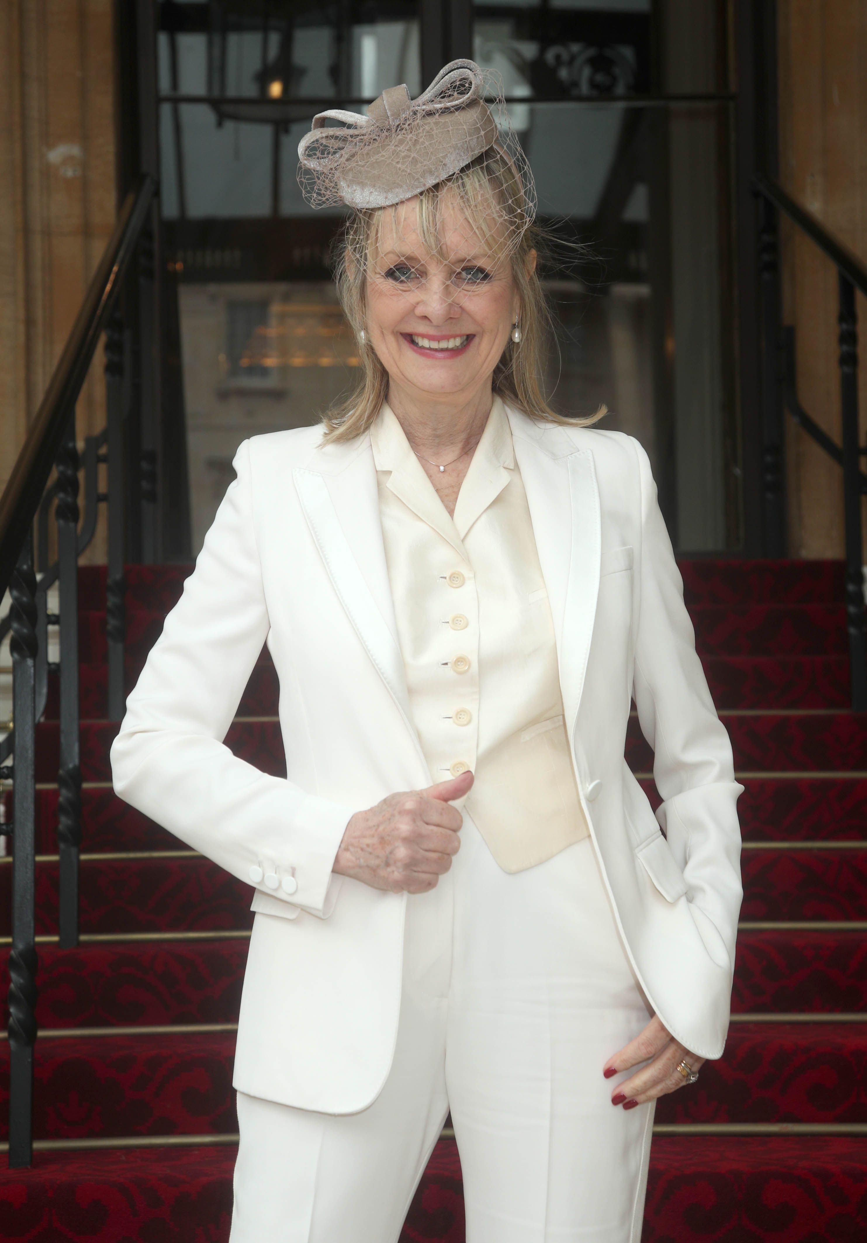 Lesley "Twiggy" Lawson arrives at Buckingham Palace where she will be made a Dame Commander of the Order of the British Empire for services to fashion, the arts and charity, during an Investiture ceremony conducted by the Prince of Wales on March 14, 2019 in London, England. | Source: Getty Images