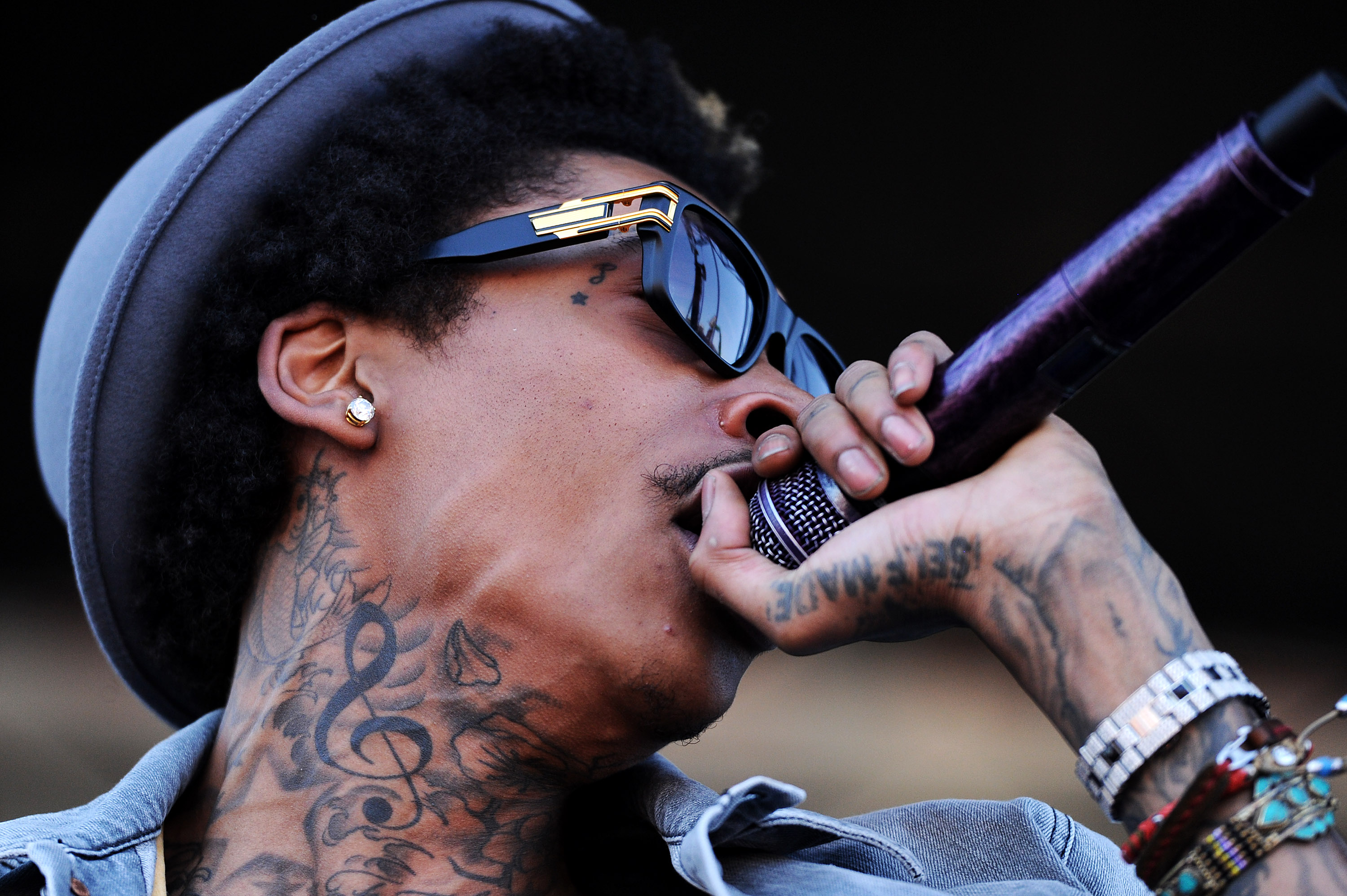 A close-up of Wiz Khalifa's tattoos captured while he performed "Young, Wild & Free" prior to the 137th running of the Preakness Stakes at Pimlico Race Course on May 19, 2012, in Baltimore, Maryland. | Source: Getty Images