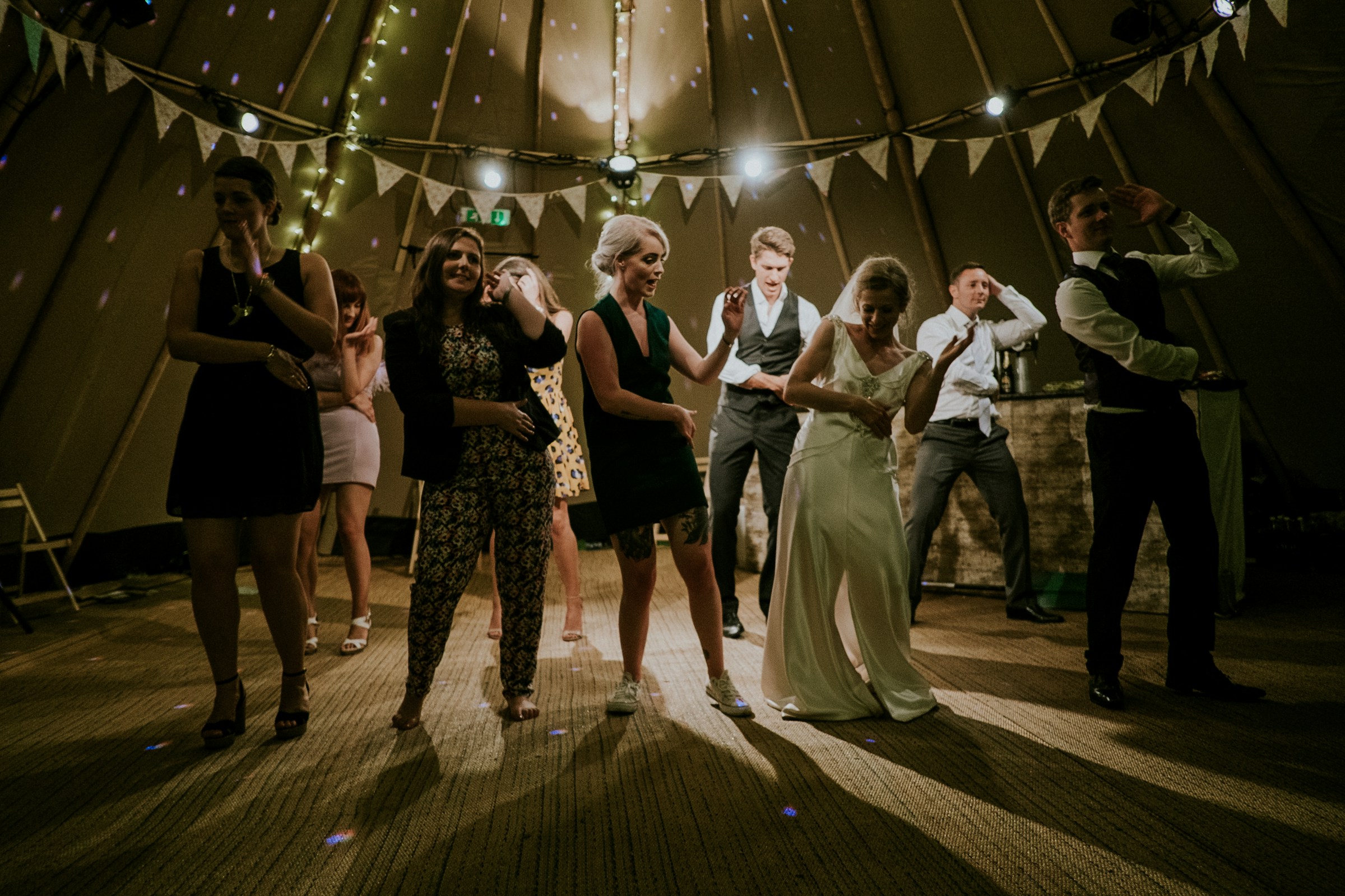 Dancing people at a wedding | Source: Unsplash