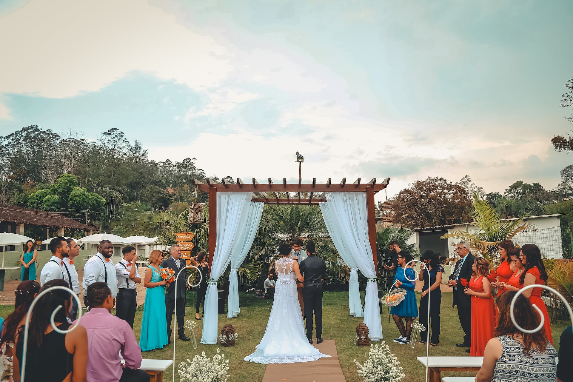 A couple getting married surrounded by their loved ones | Source: Pexels