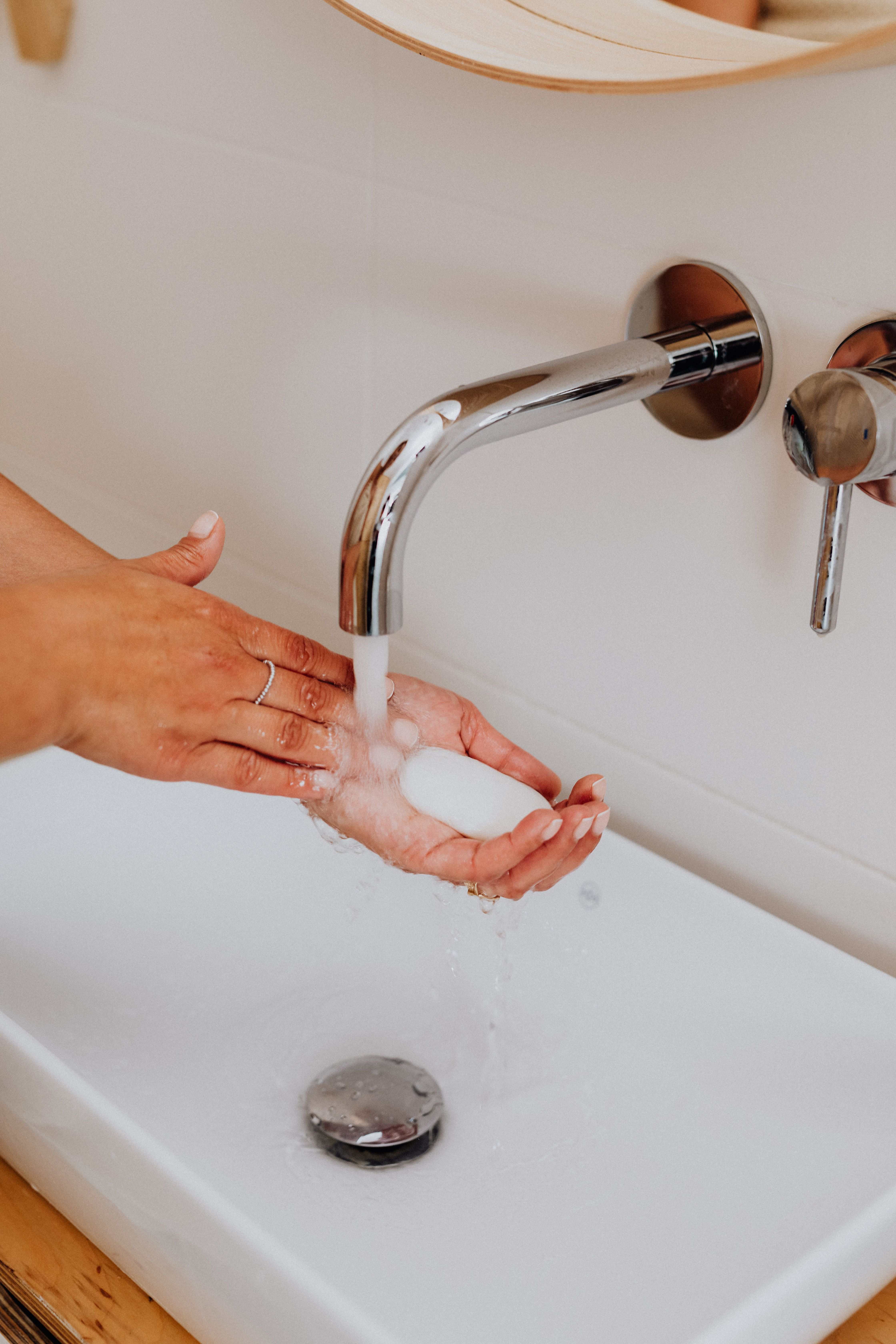 A person washing their hands with a liquid soap | Source: Pexels