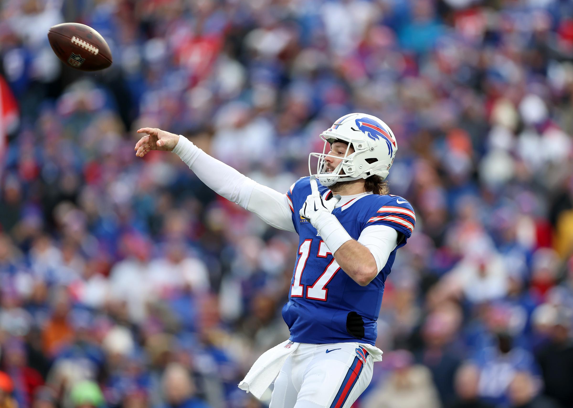 Josh Allen throwing a 33-yard pass in the fourth quarter against the Denver Broncos. | Source: Getty Images