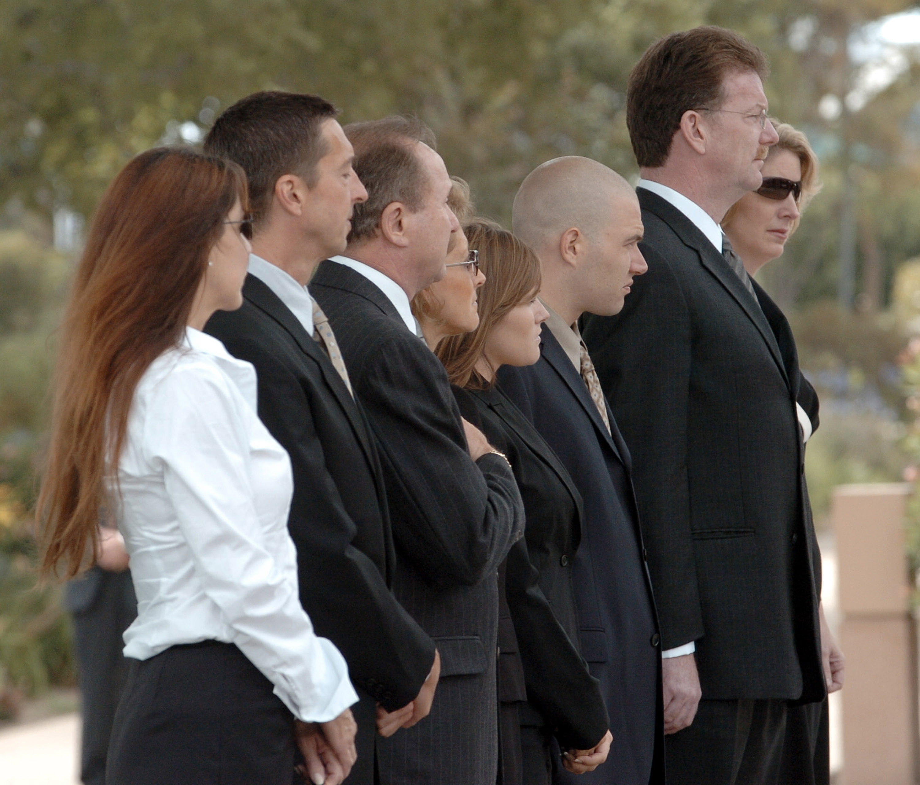 Patti Davis, Ron Reagan Jr, and Michael Reagan stand outside the Reagan Presidential Library in Simi Valley, California, on June 7, 2004 | Source: Getty Images