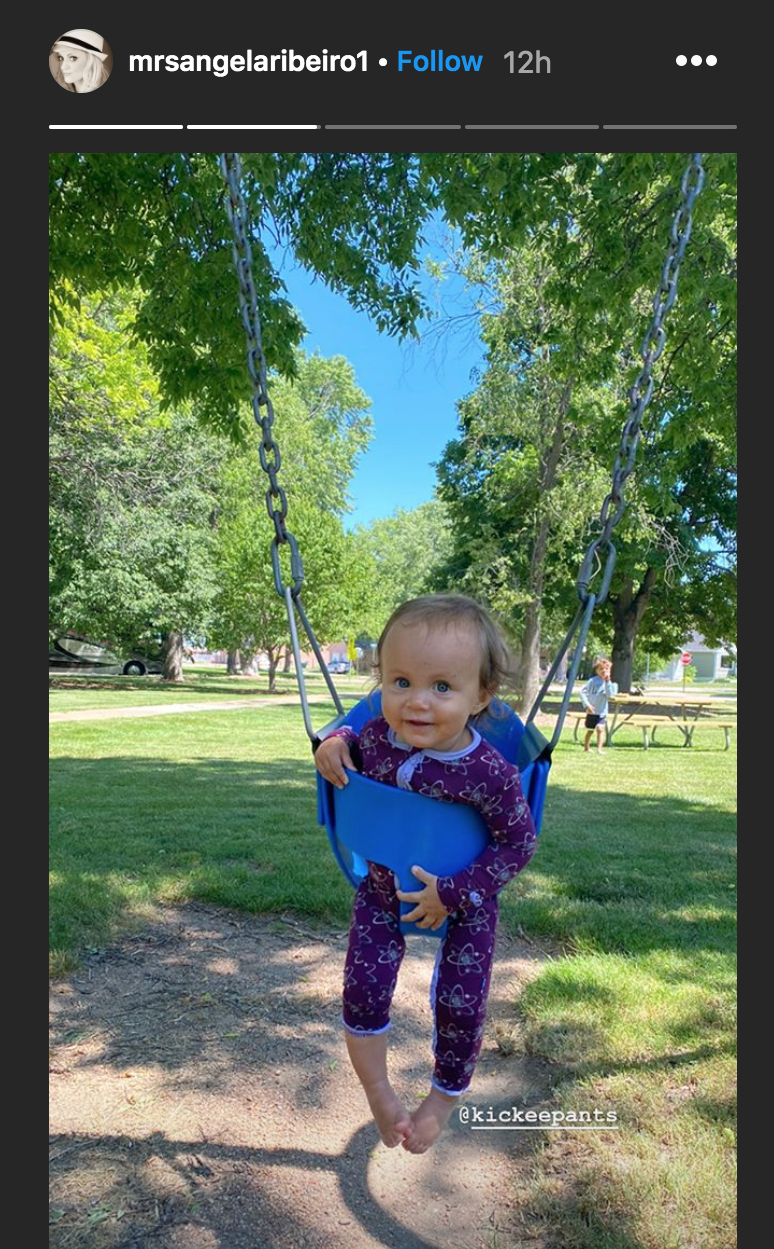 Ava Sue Ribeiro hangs from a baby swing in a park in Nebraska | Source: Instagram.com/mrsangelaribeiro1