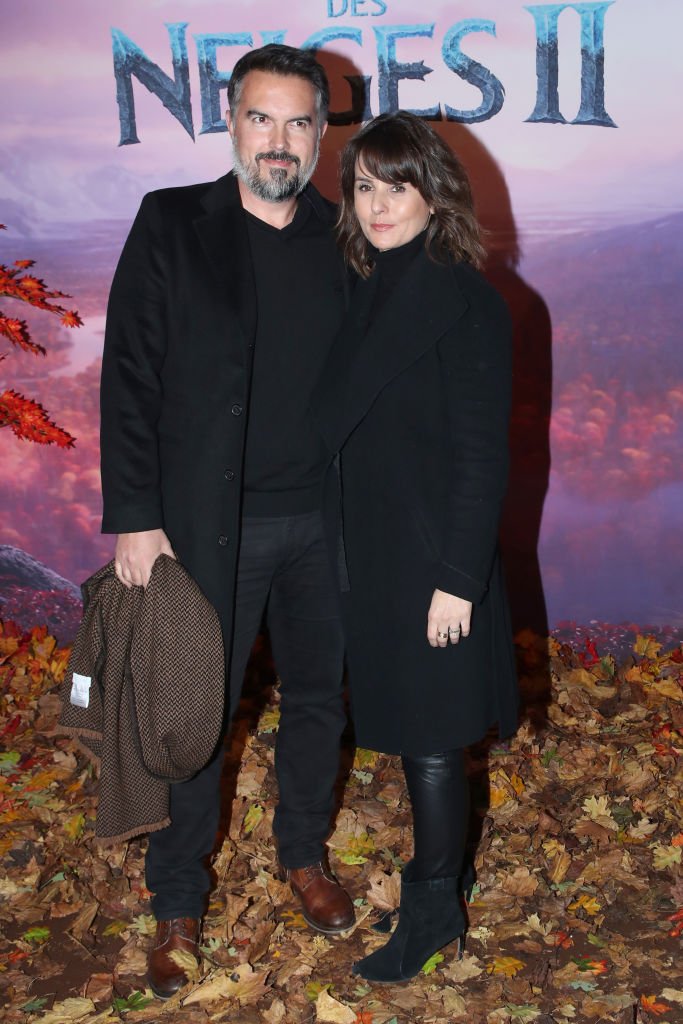 Maxime Chattam et Faustine Bollaert assistent à la projection de gala "Frozen 2 le 13 novembre 2019. | Photo : Getty Images