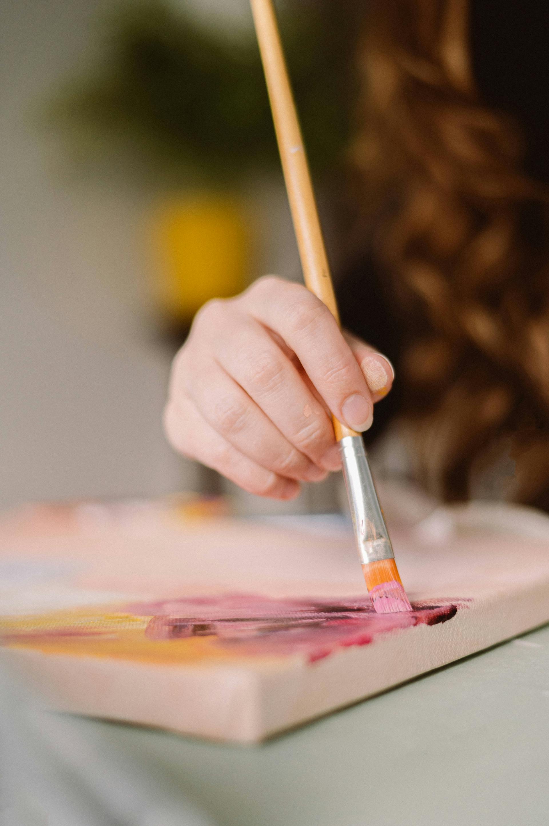 Close-up shot of a woman painting | Source: Pexels