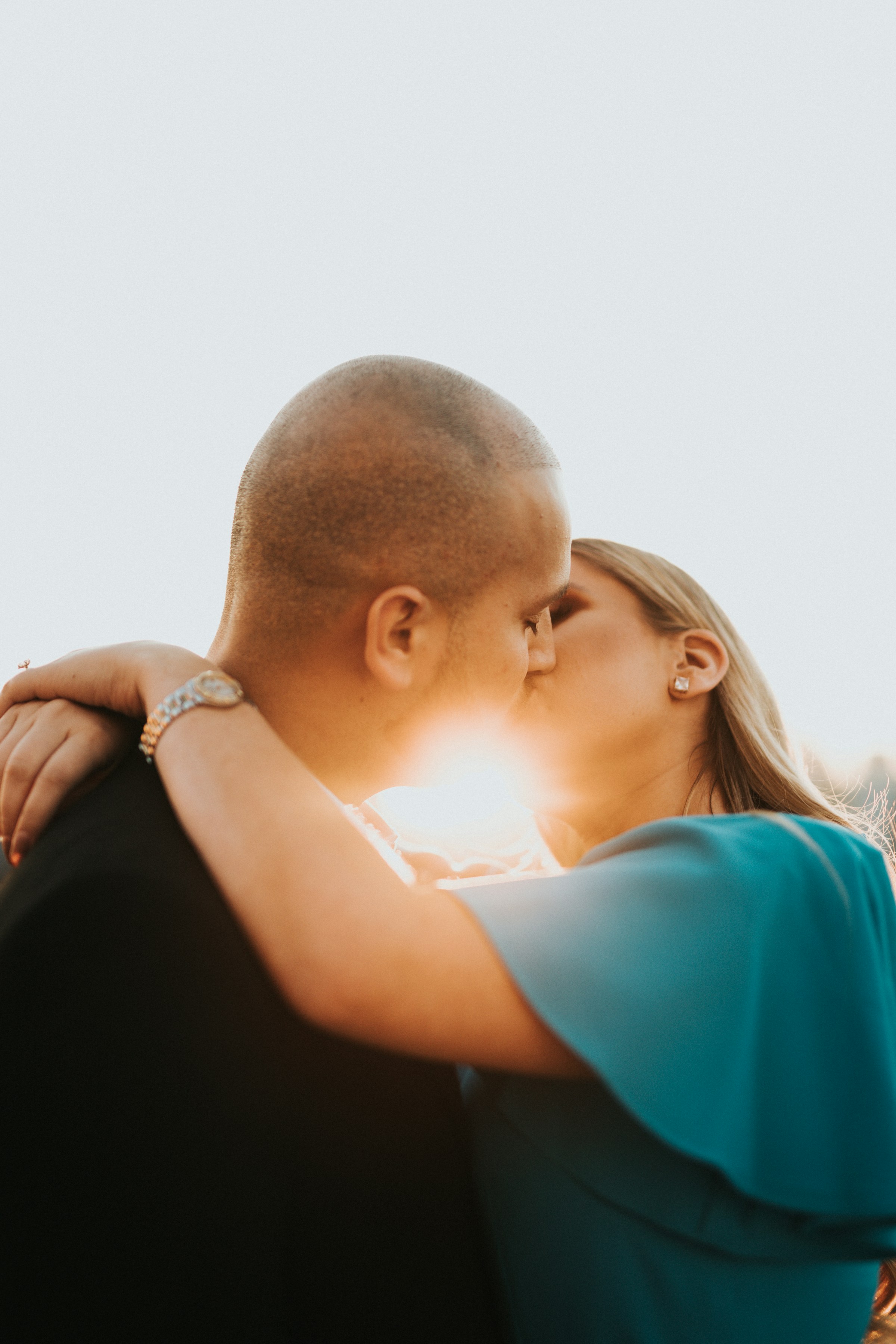 A man kissing his wife goodbye | Source: Unsplash