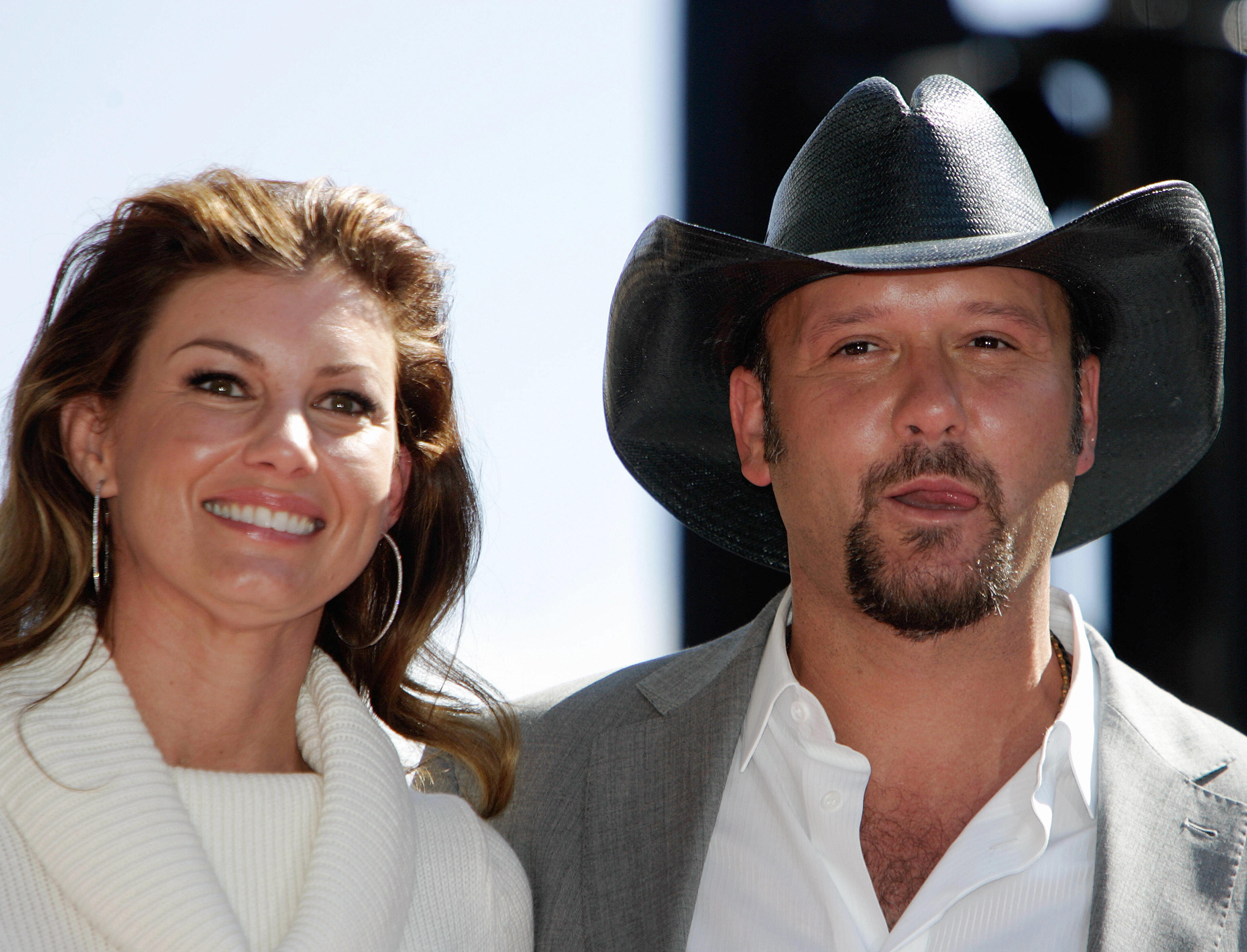 Faith Hill and Tim McGraw in an early public appearance. Married since 1996, the country music stars have raised three daughters—Gracie, Maggie, and Audrey—who have each gone on to forge their own paths. | Source: Getty Images