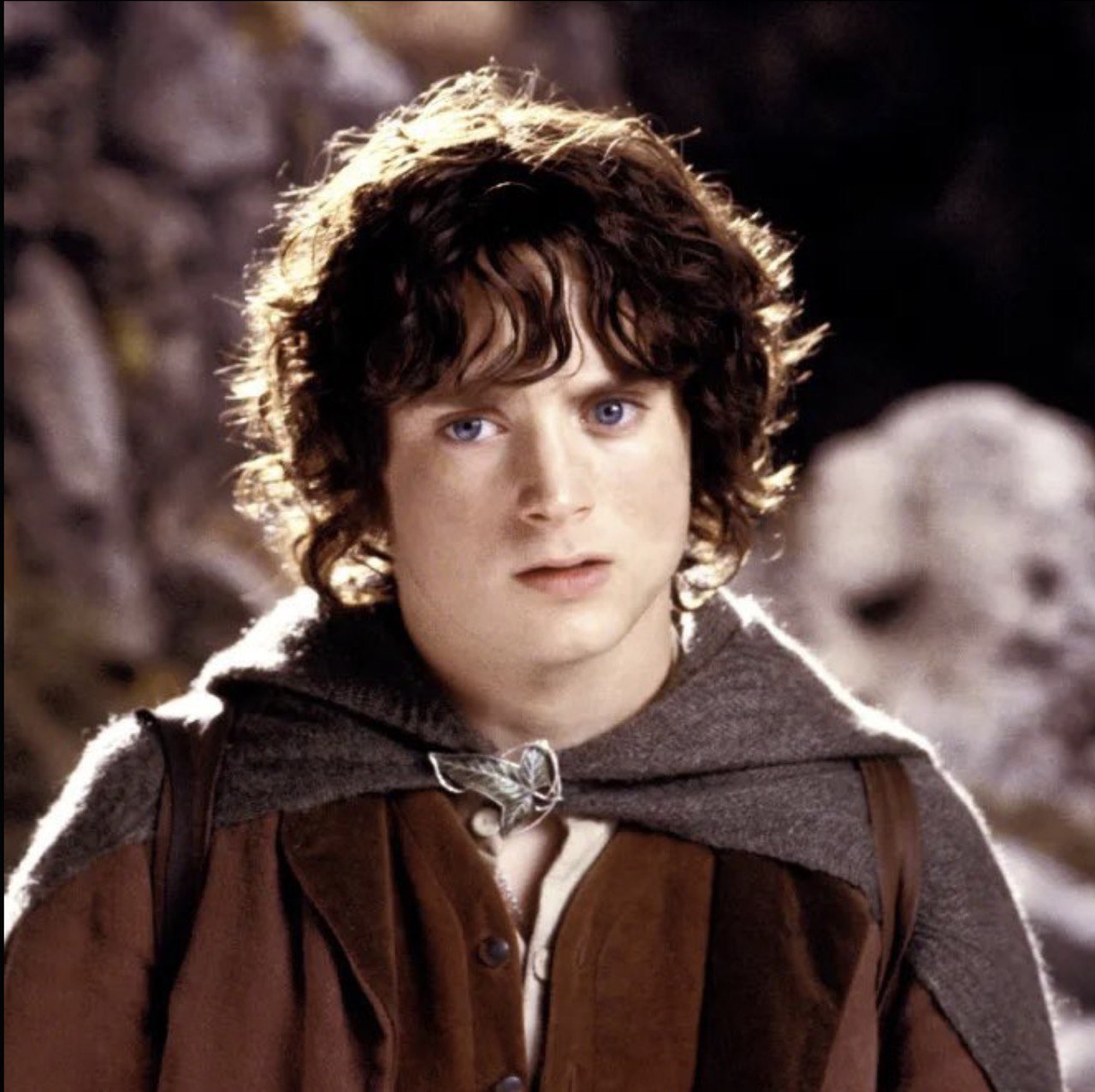 In "The Fellowship of the Ring," Elijah Wood portrayed Frodo Baggins, the reluctant Hobbit chosen to carry the One Ring into the heart of danger. With wide blue eyes, tousled curls, and a fragile determination, his youthful face came to symbolise the innocence and courage at the heart of Middle-earth's most perilous quest. | Source: The Fellowship of the Ring