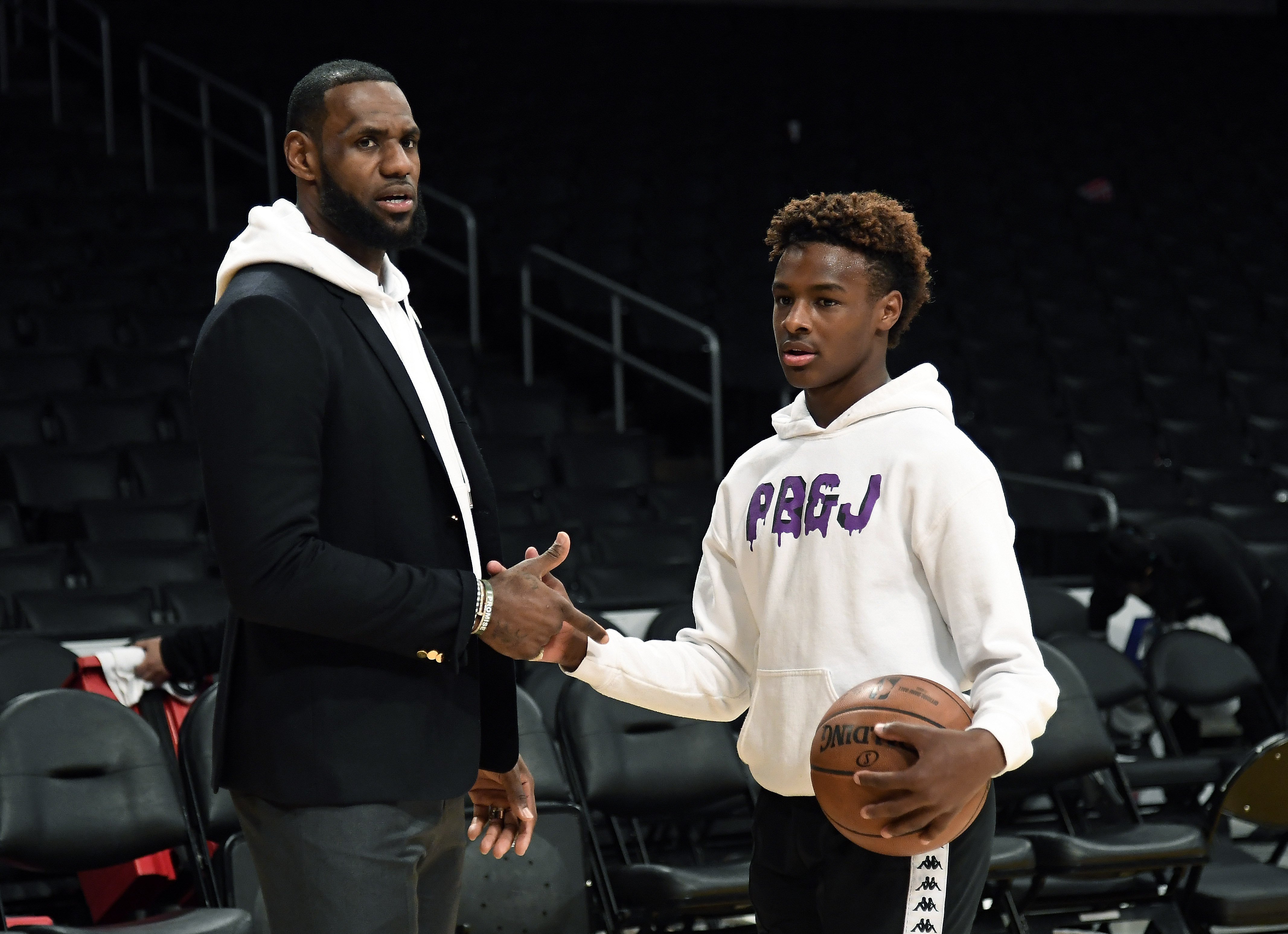 LeBron James and his son LeBron James Jr., on the court after a game on Dec. 28, 2018 in California | Photo: Getty Images