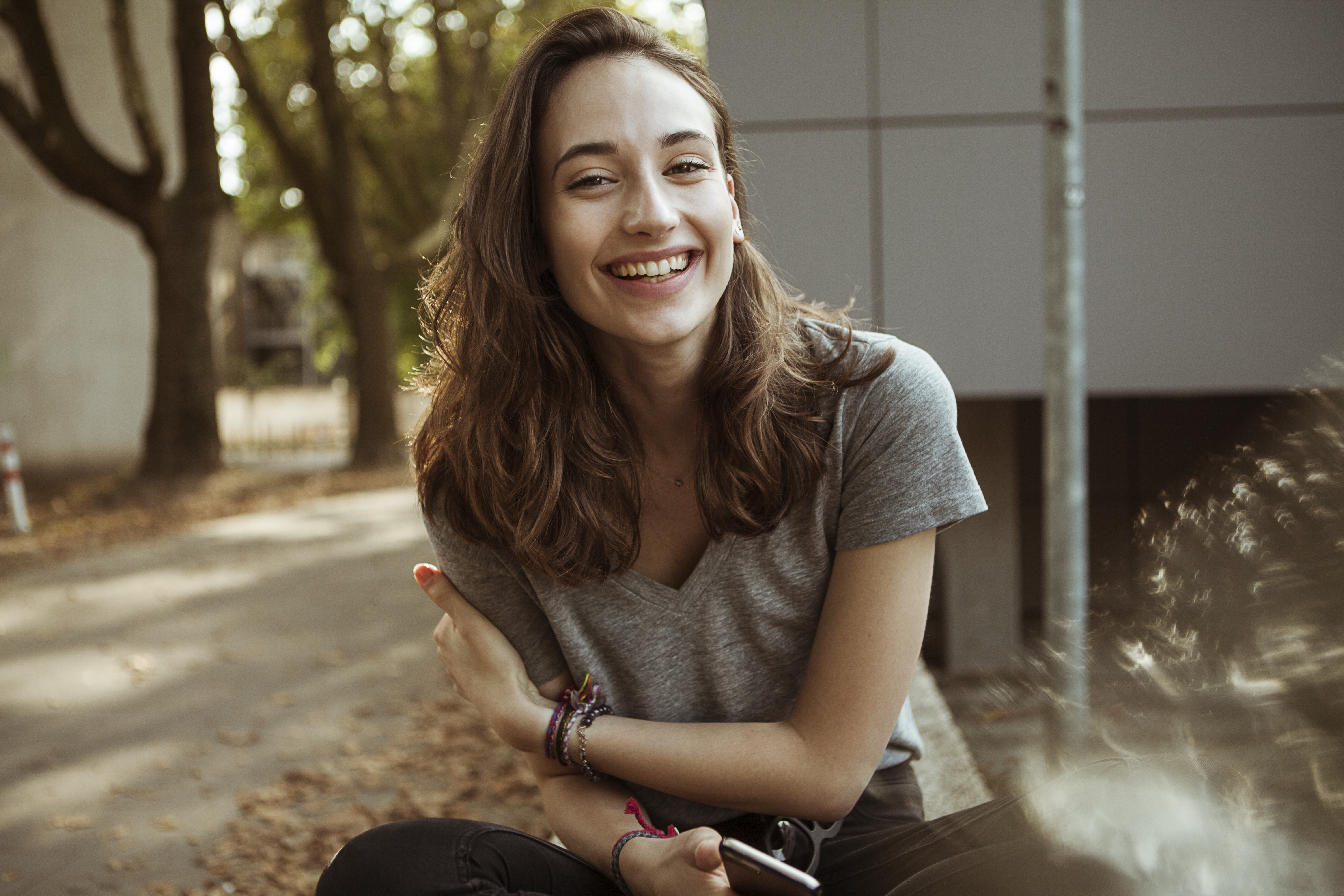 Portrait of happy young woman outdoors | Source: Getty Images