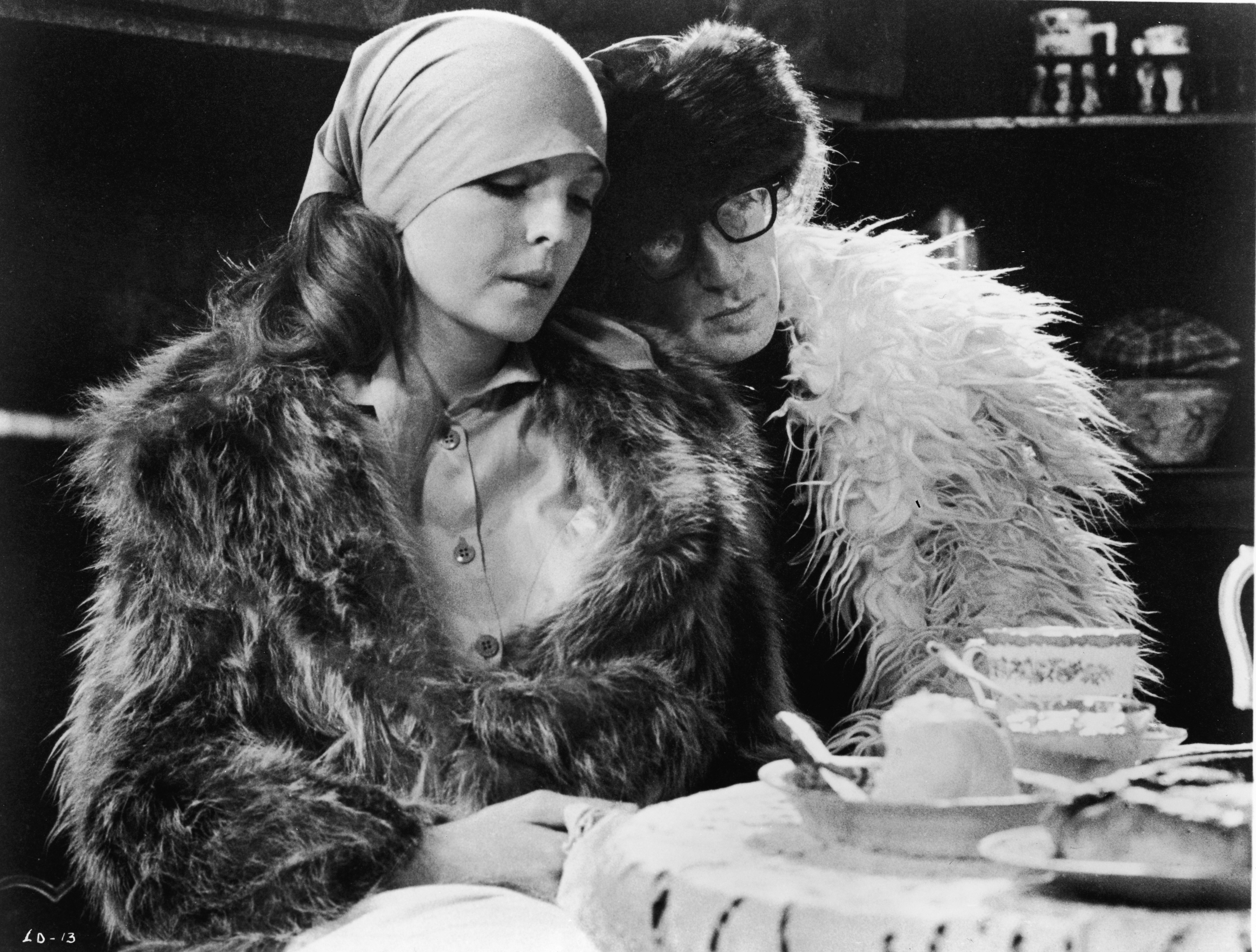 Woody Allen leans his head on the shoulder of Diane Keaton in a scene from "Love and Death" in 1975 | Source: Getty Images