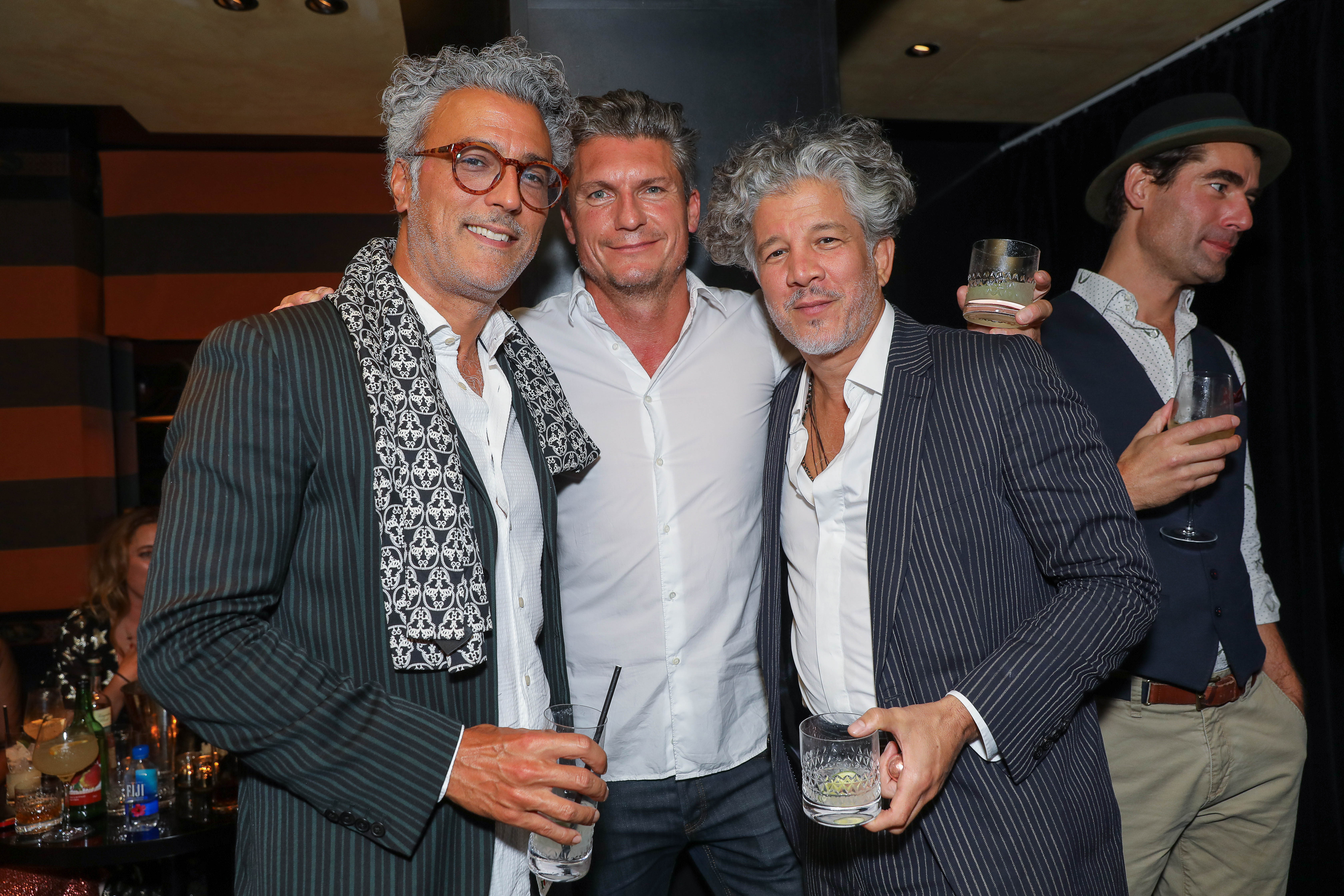 Glen Atchison, Fabrizio Zapanetta and Lucho Brieva attend the Temperley London SS19 after party at Bungalow Blakes on September 15, 2018 in London, England. | Source: Getty Images